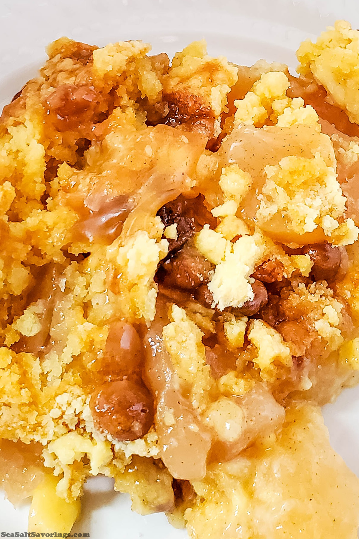 close up image of caramel apple dump cake showing details of texture and ingredients