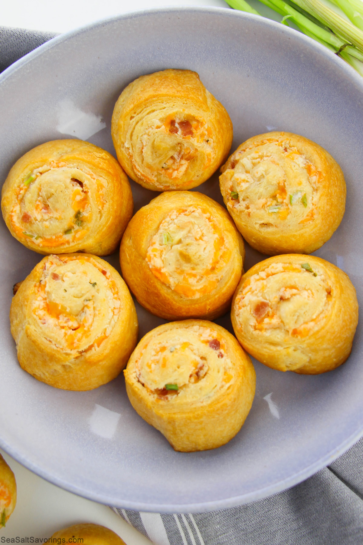 loaded dinner rolls in a bowl freshly baked golden brown