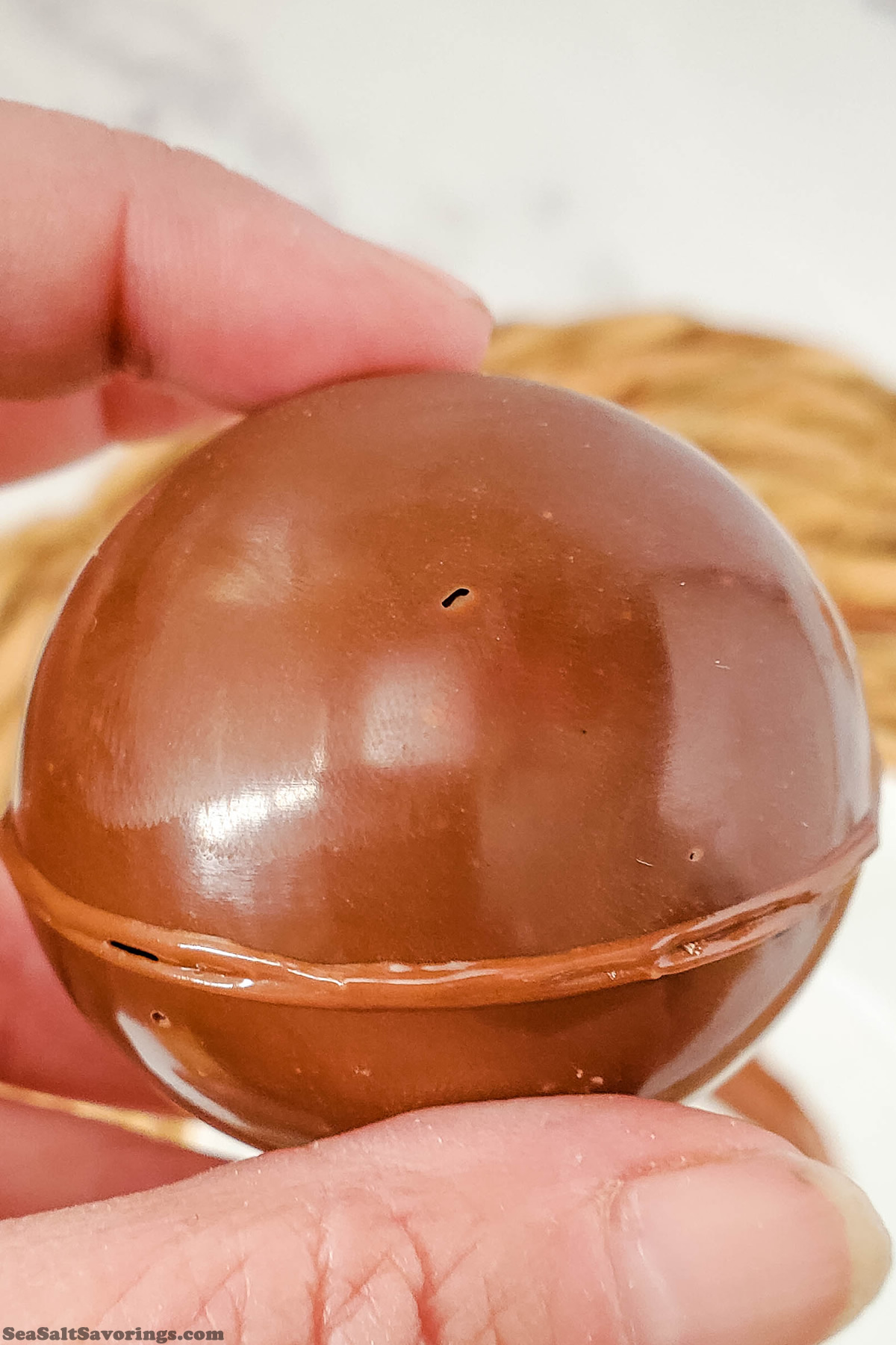 closing two halves of a chocolate ball together