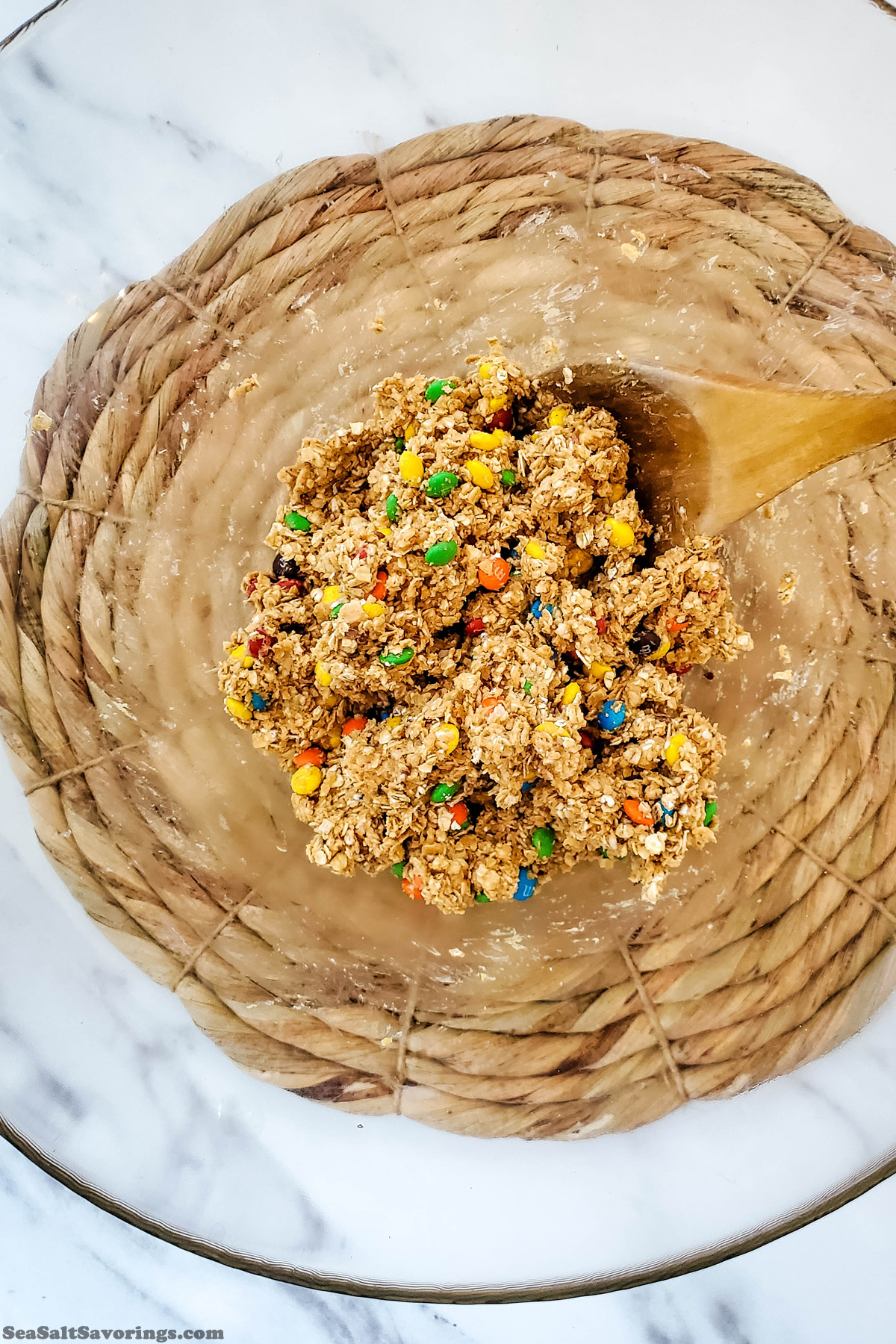 mixing all ingredients together with wooden spoon