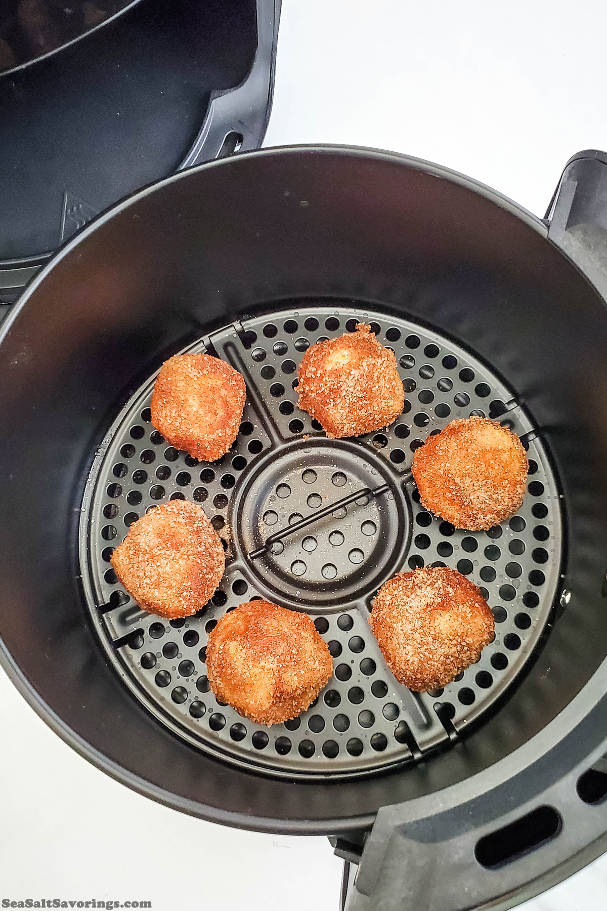 placing dough balls in air fry basket