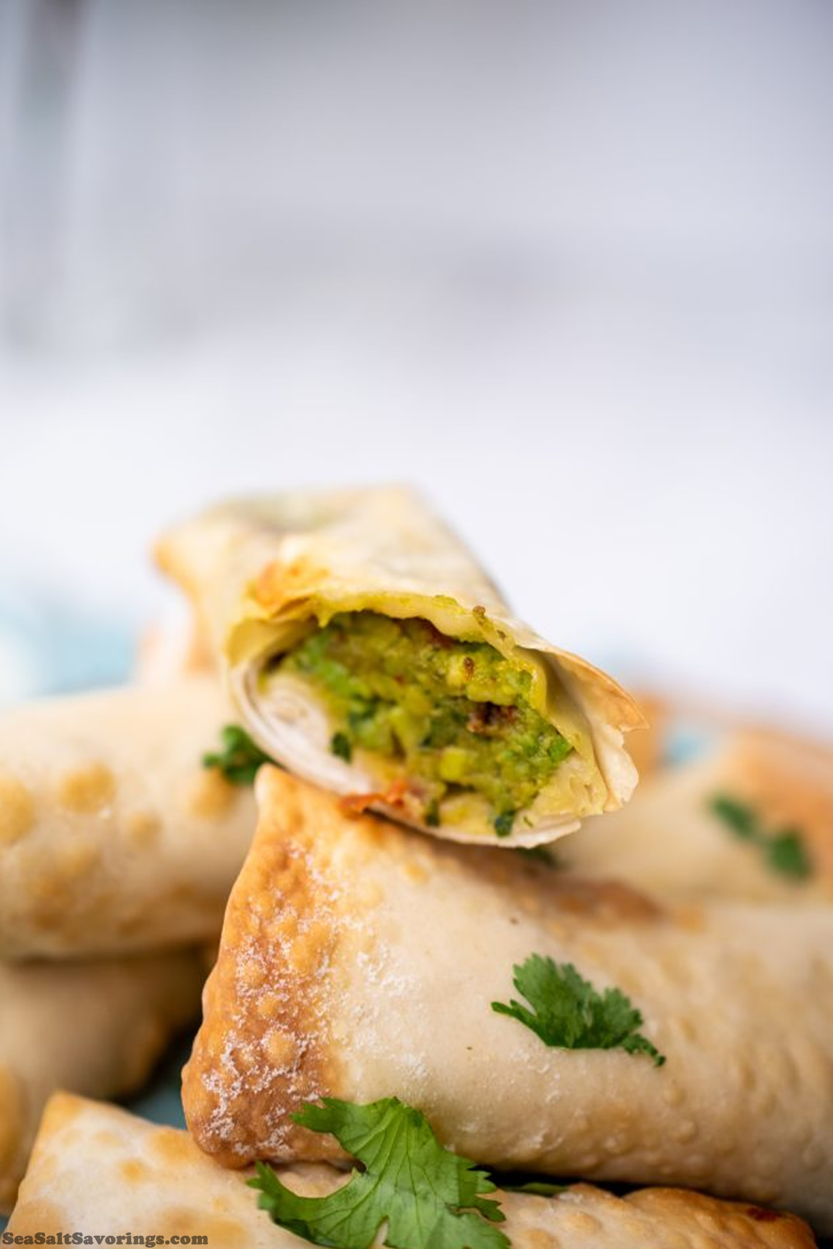 avocado eggroll stacked and cut open to show filling