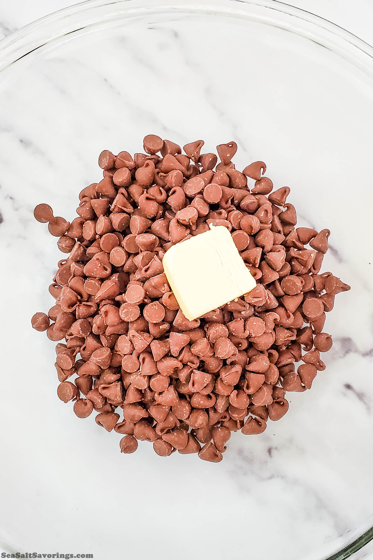 adding chocolate chips and butter to mixing bowl