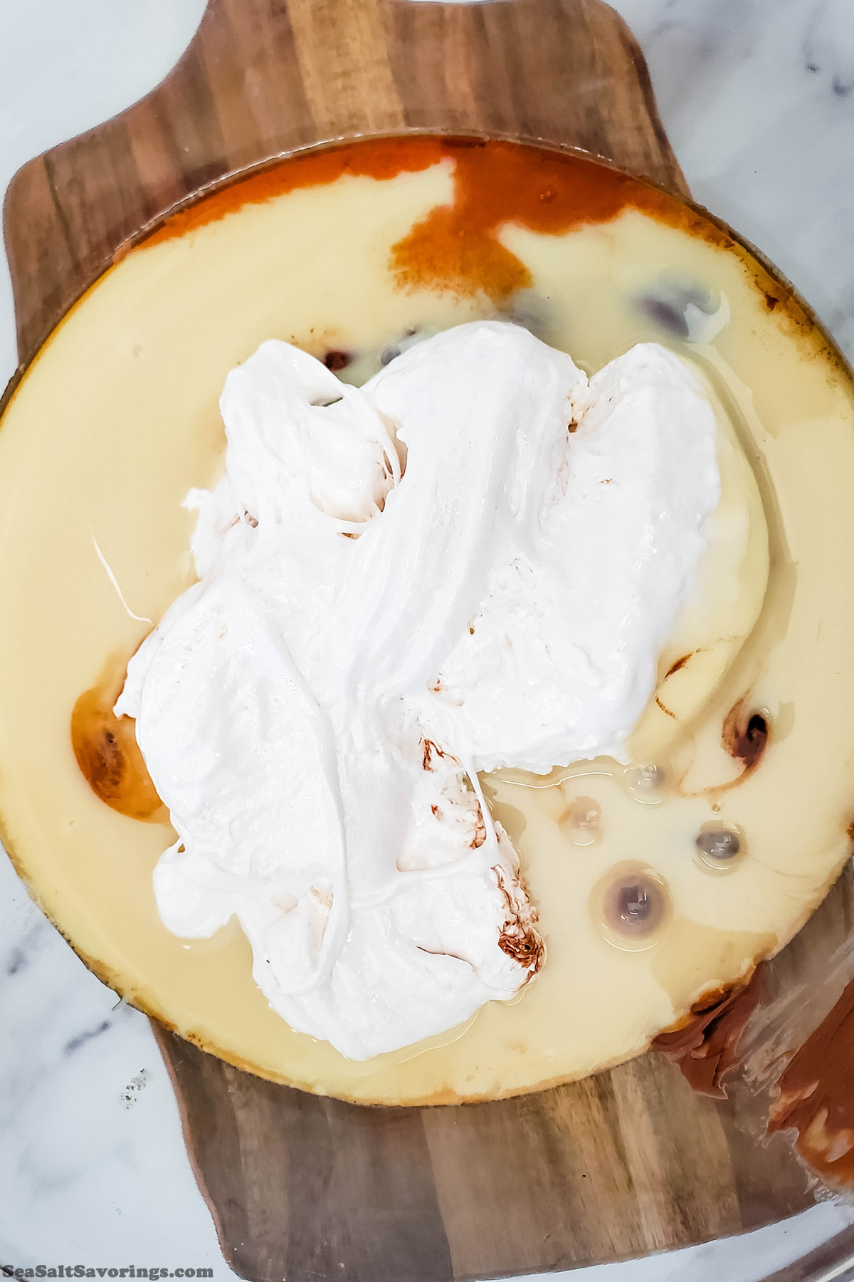 adding wet ingredients to mixing bowl