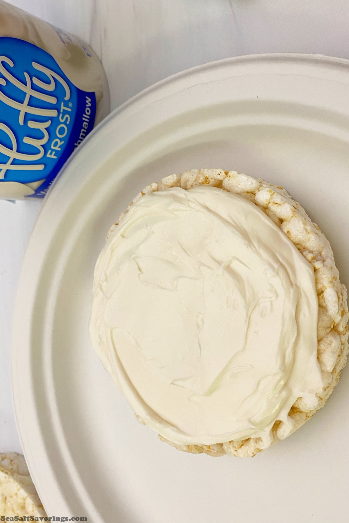 rice cake with a layer of white frosting added