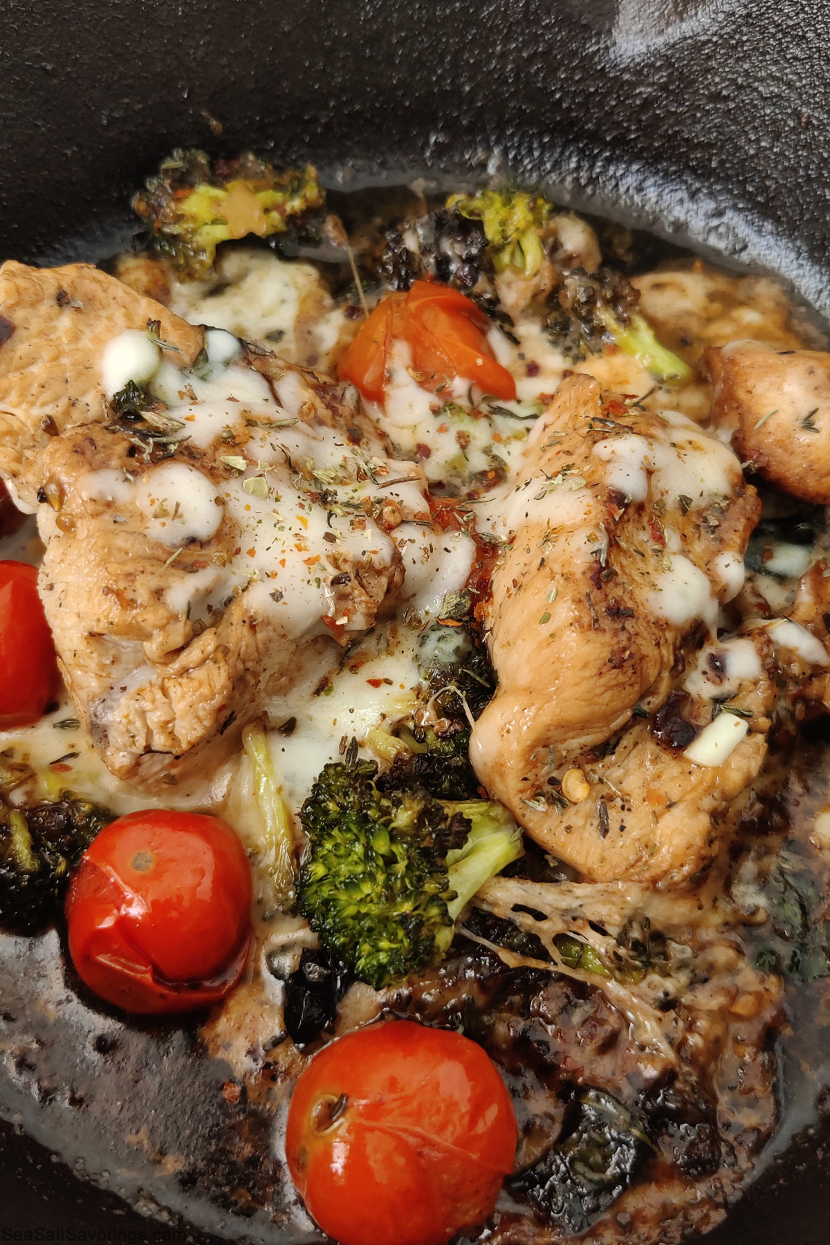 balsamic chicken dish close up view in frying pan