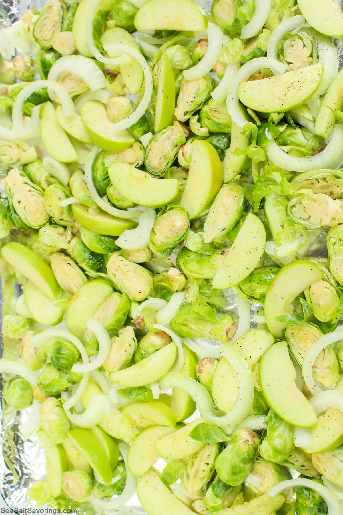 sheet pan of slices brussel sprouts and apples