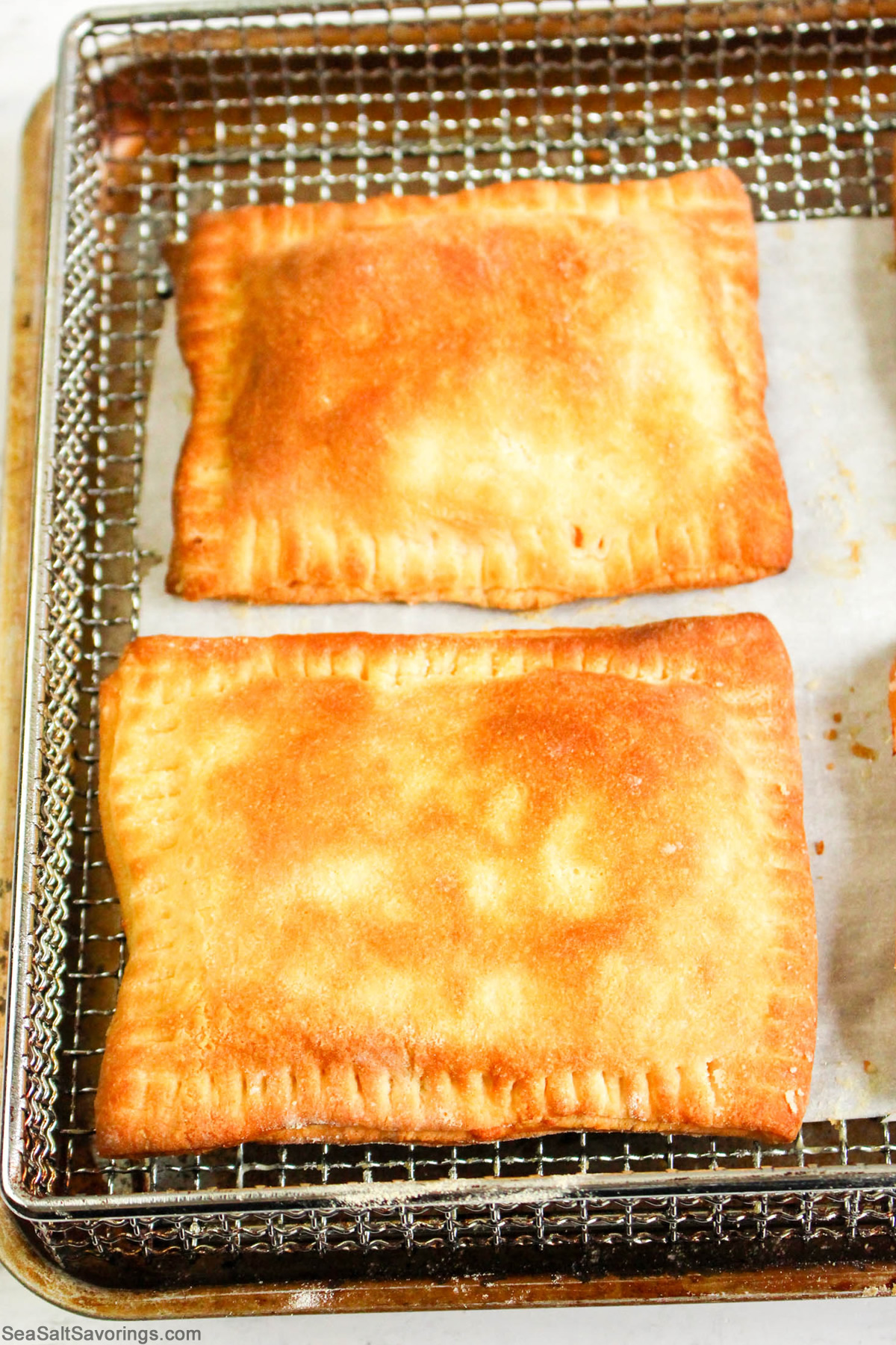 ham and cheese pocket sandwiches freshly baked on a cookie sheet