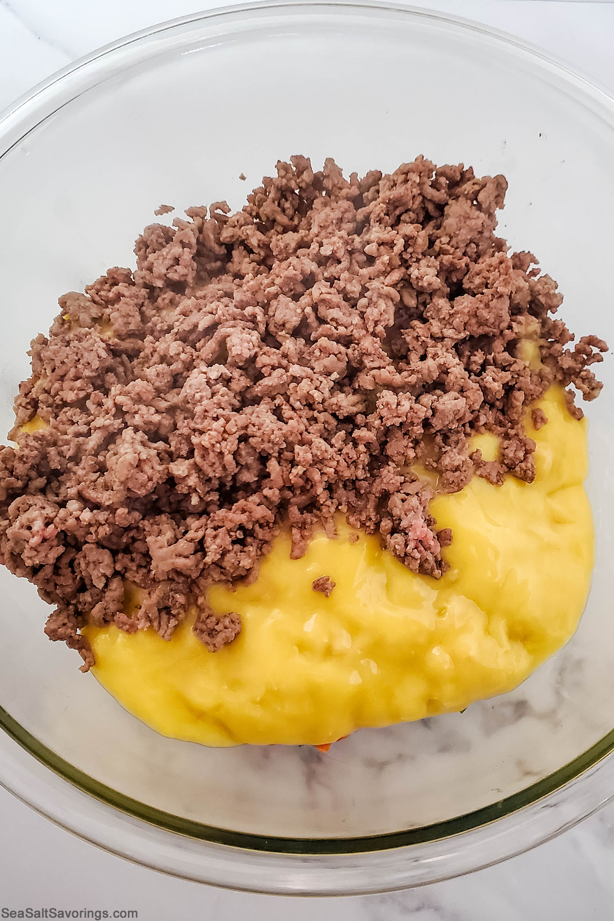 mixing bowl with ground beef and mushroom soup