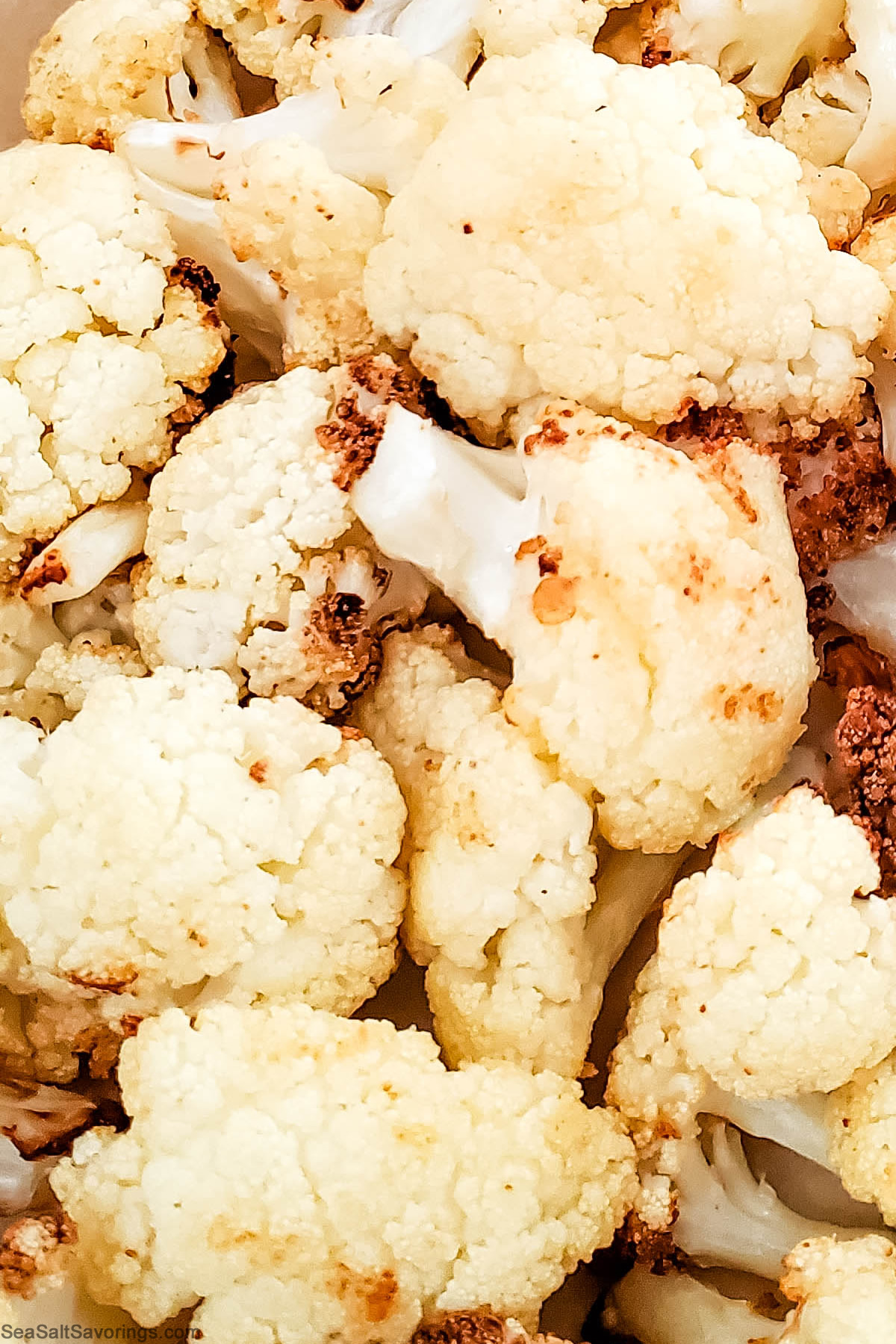 close up view of air fried cauliflower detailing the crispy textures