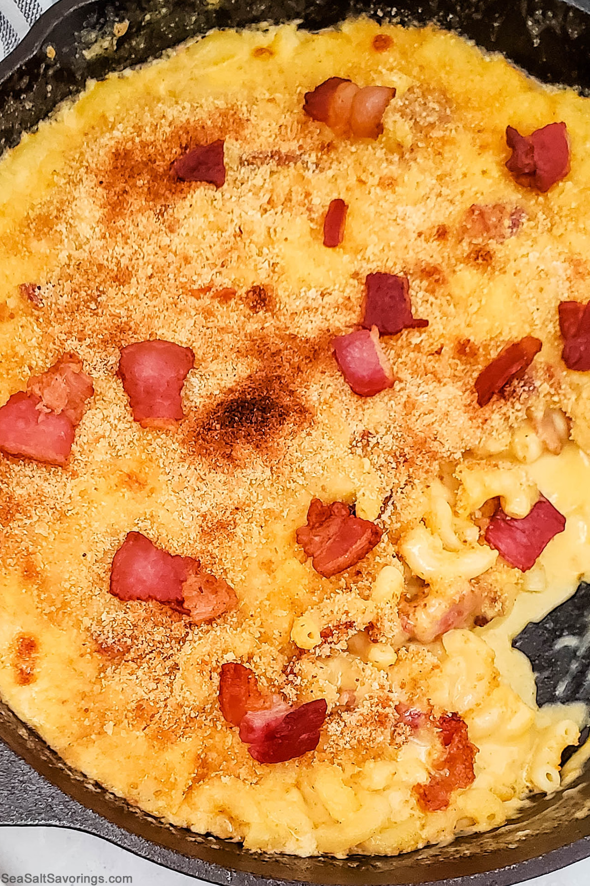 bacon mac and cheese freshly baked in skillet