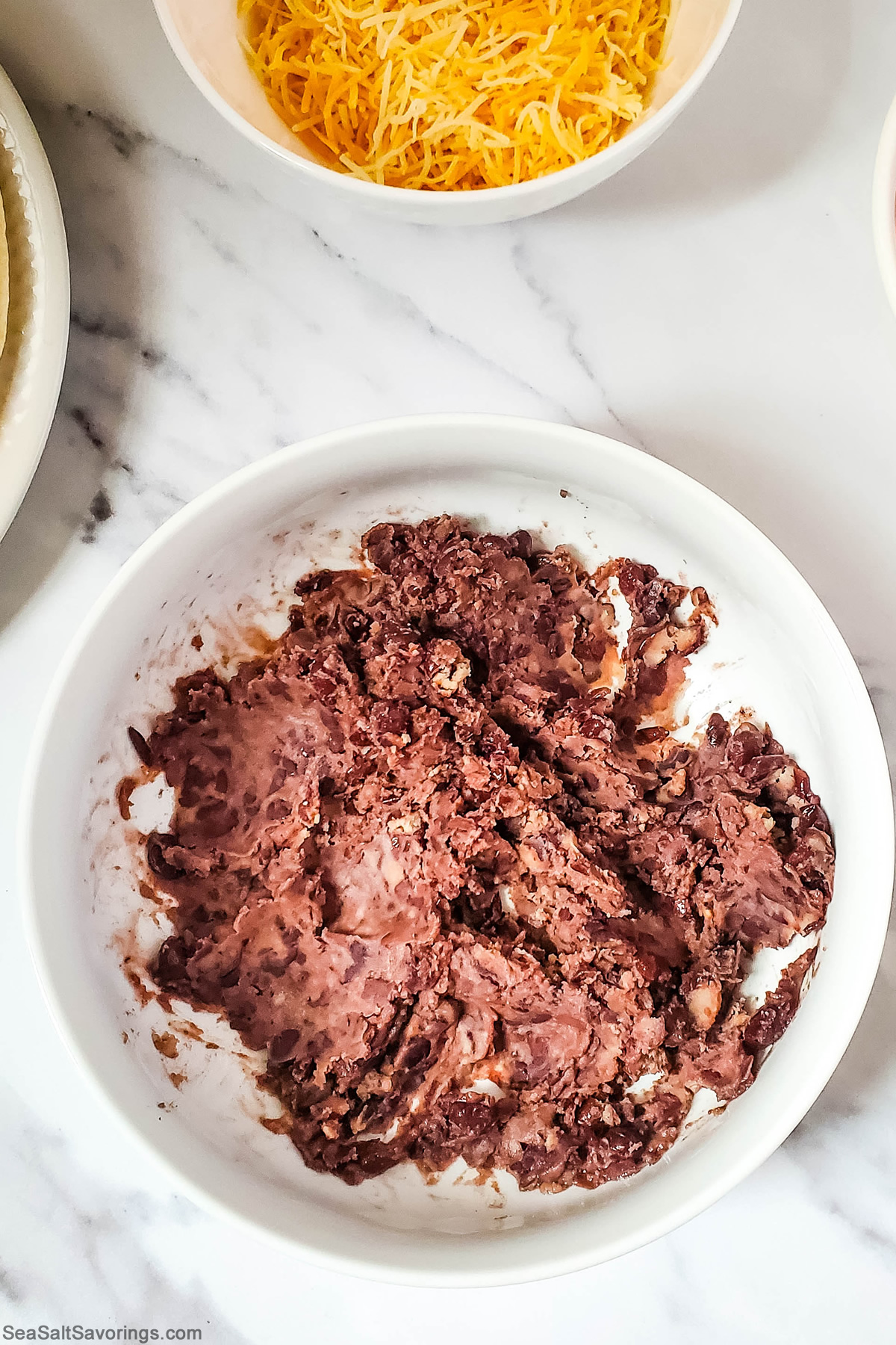 bowl of mashed up black beans