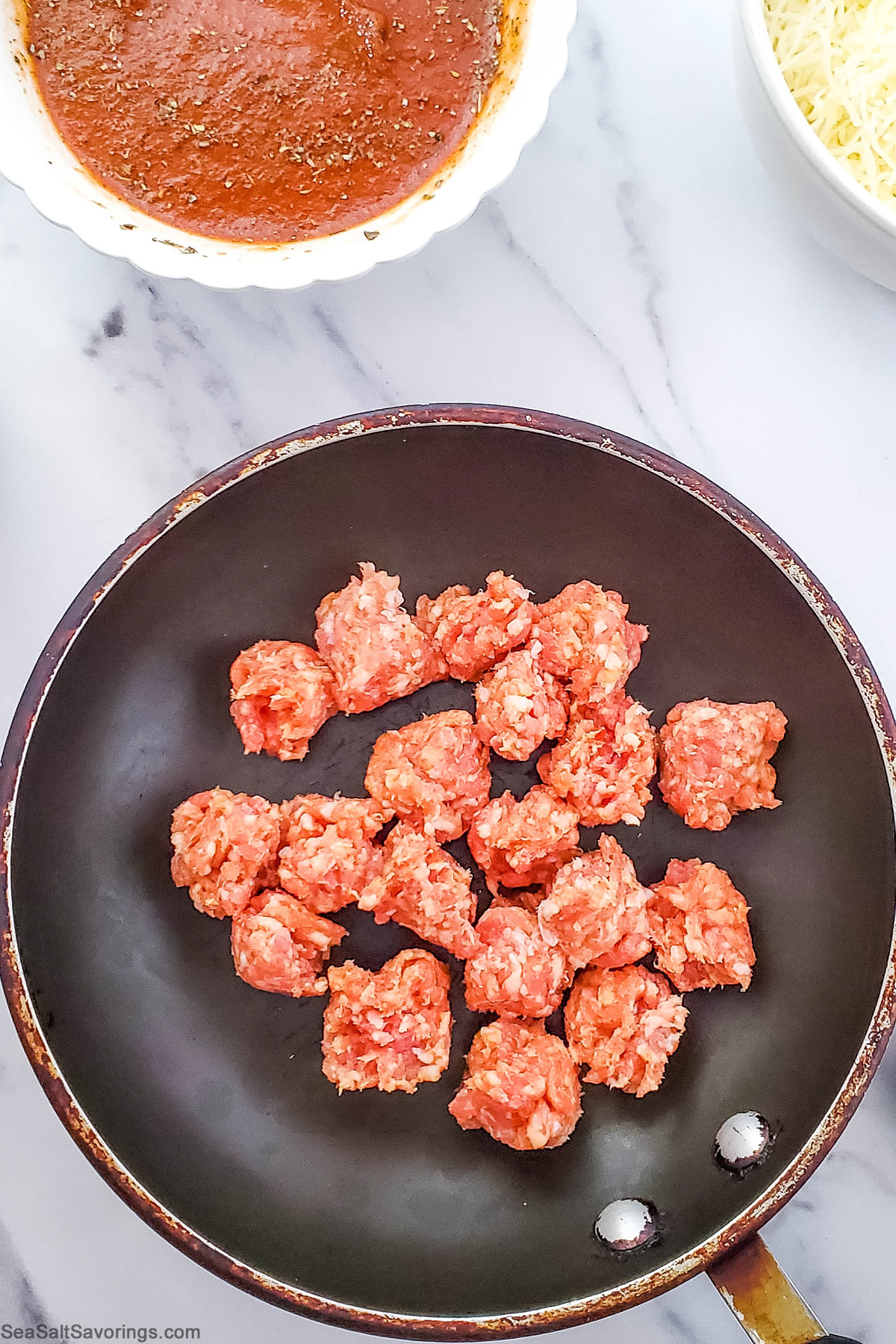 cooking balls of sausage in a skillet