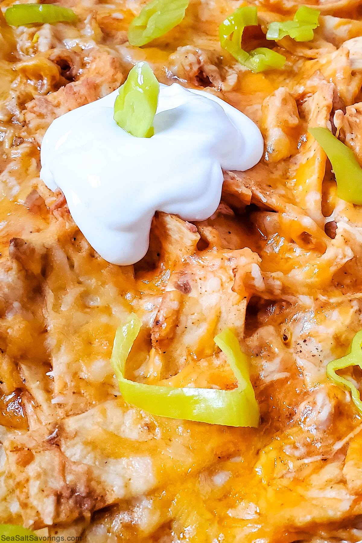 close up view of chicken enchilada to showcase the creamy textures