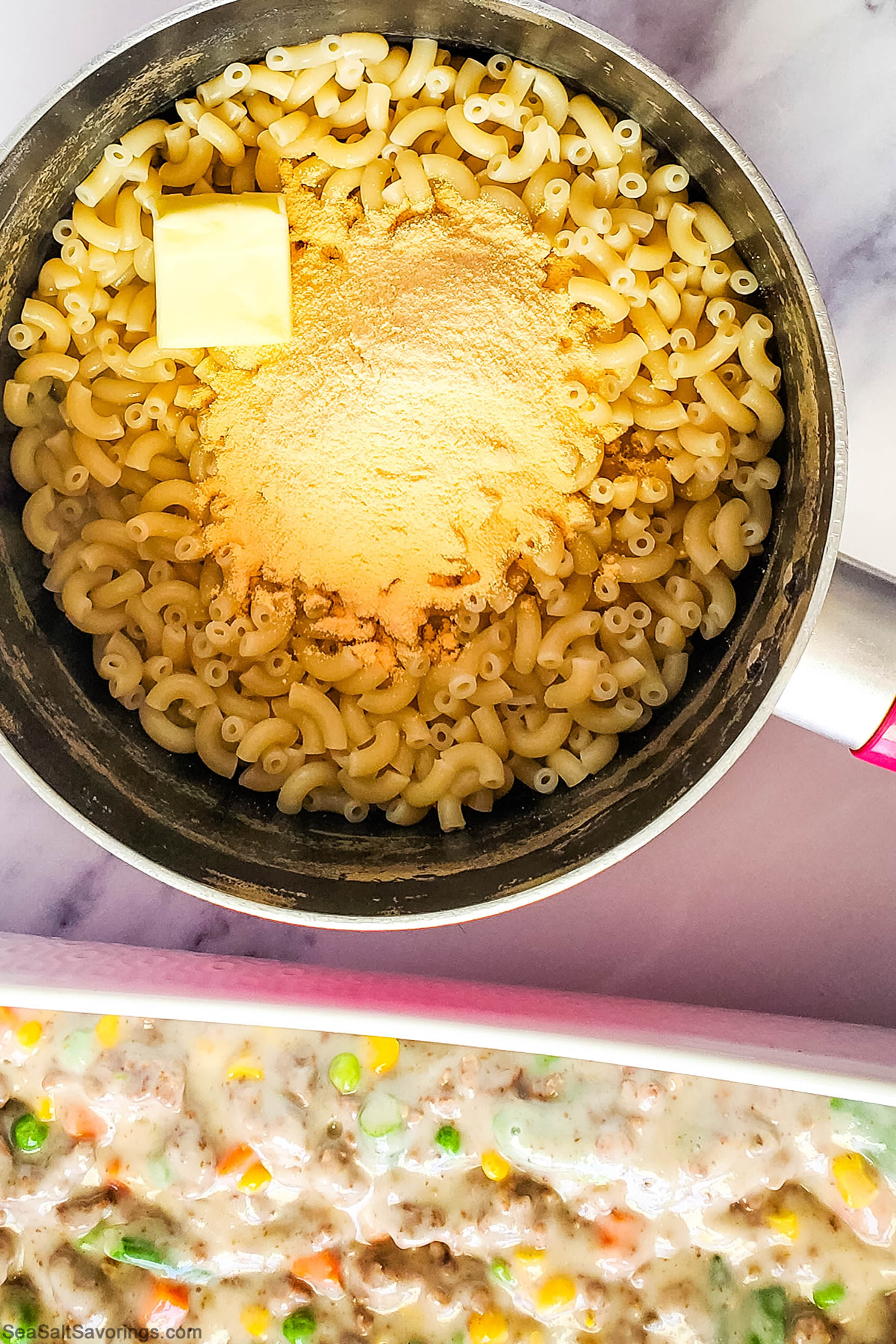 pot of mac and cheese next to baking dish that has shepherds pie filling in it