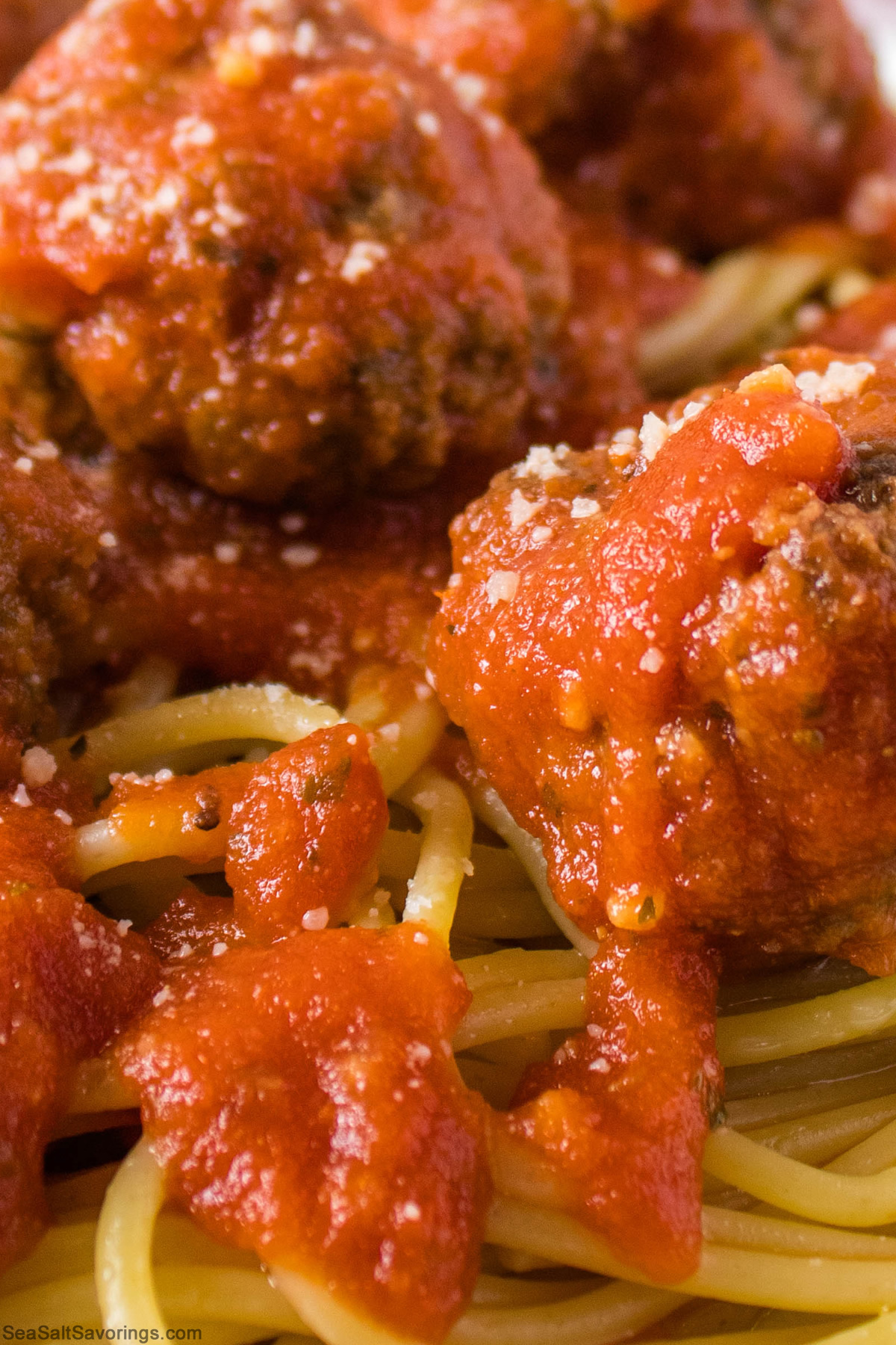 close up view of spaghetti with meatballs and red sauce