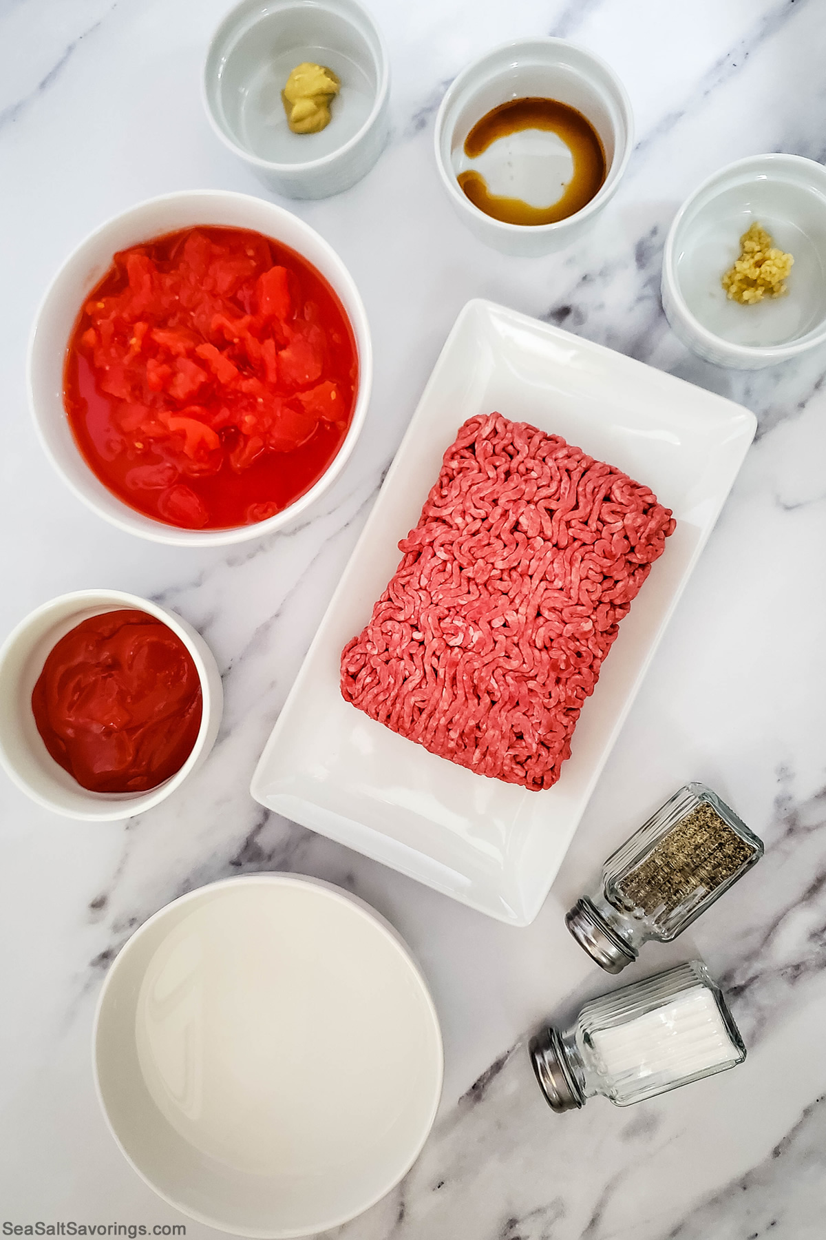 ingredients for sloppy joes in bowls on a table