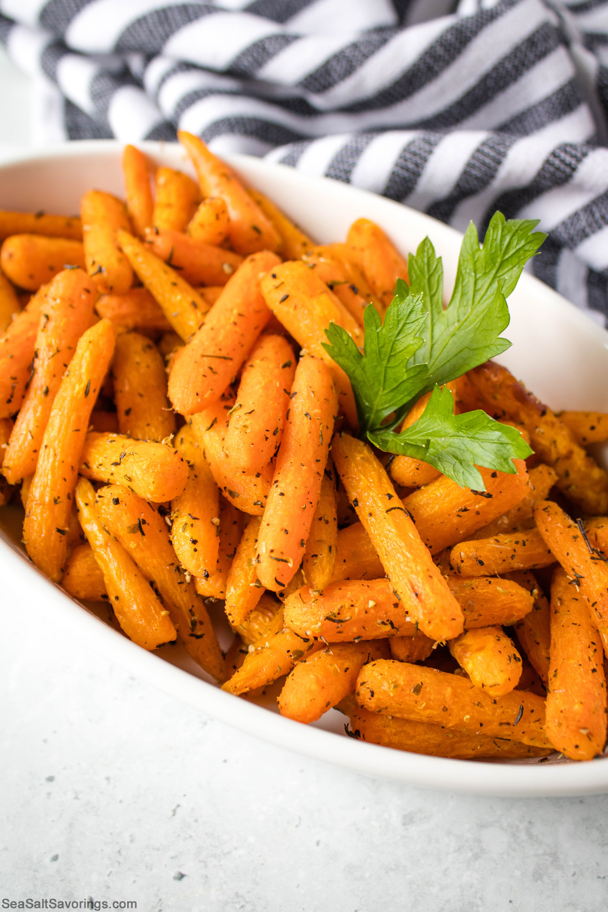 big platter of air fried carrots with leafy garnish