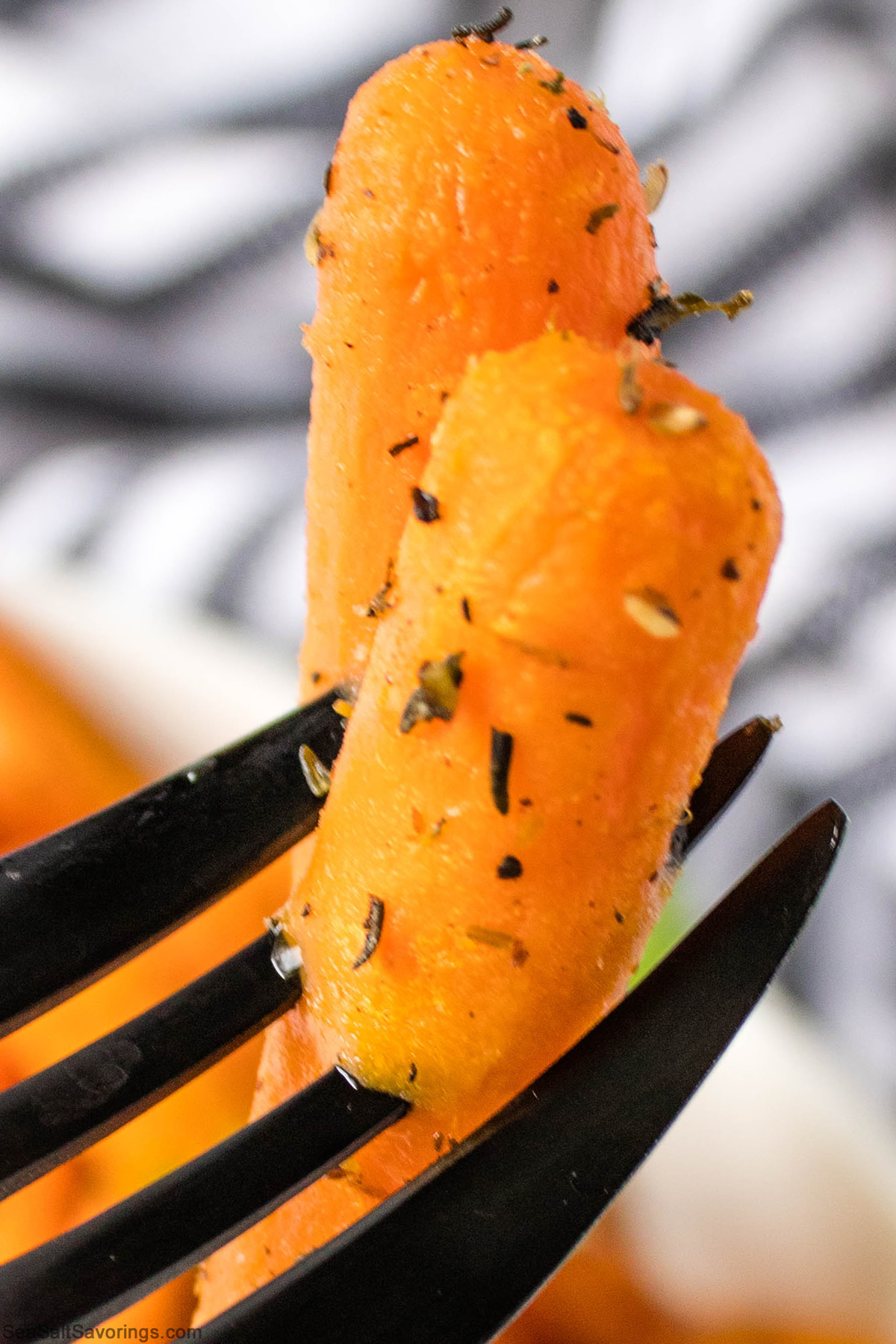 close up view of air fried carrot with crusty season on it