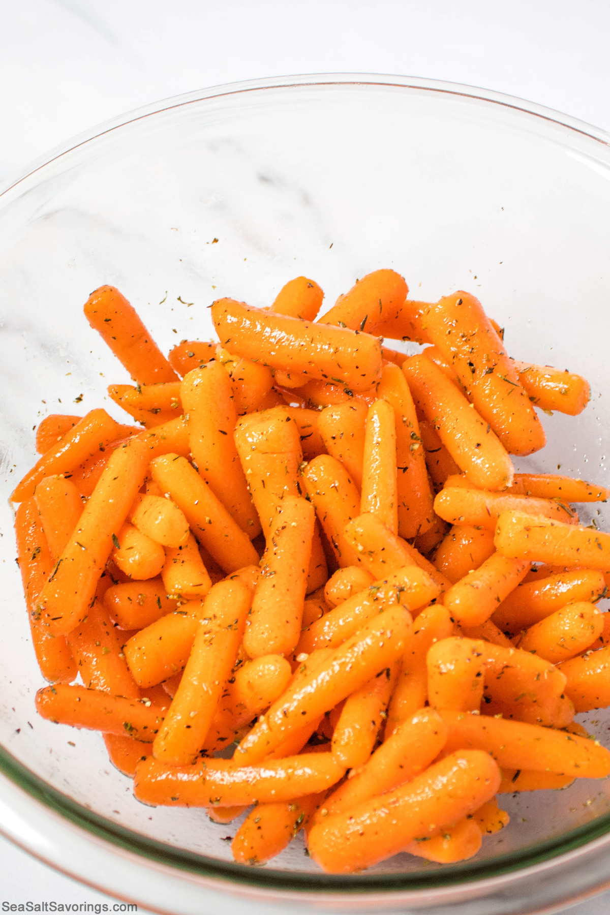 bowl of baby carrots covered in seasoning