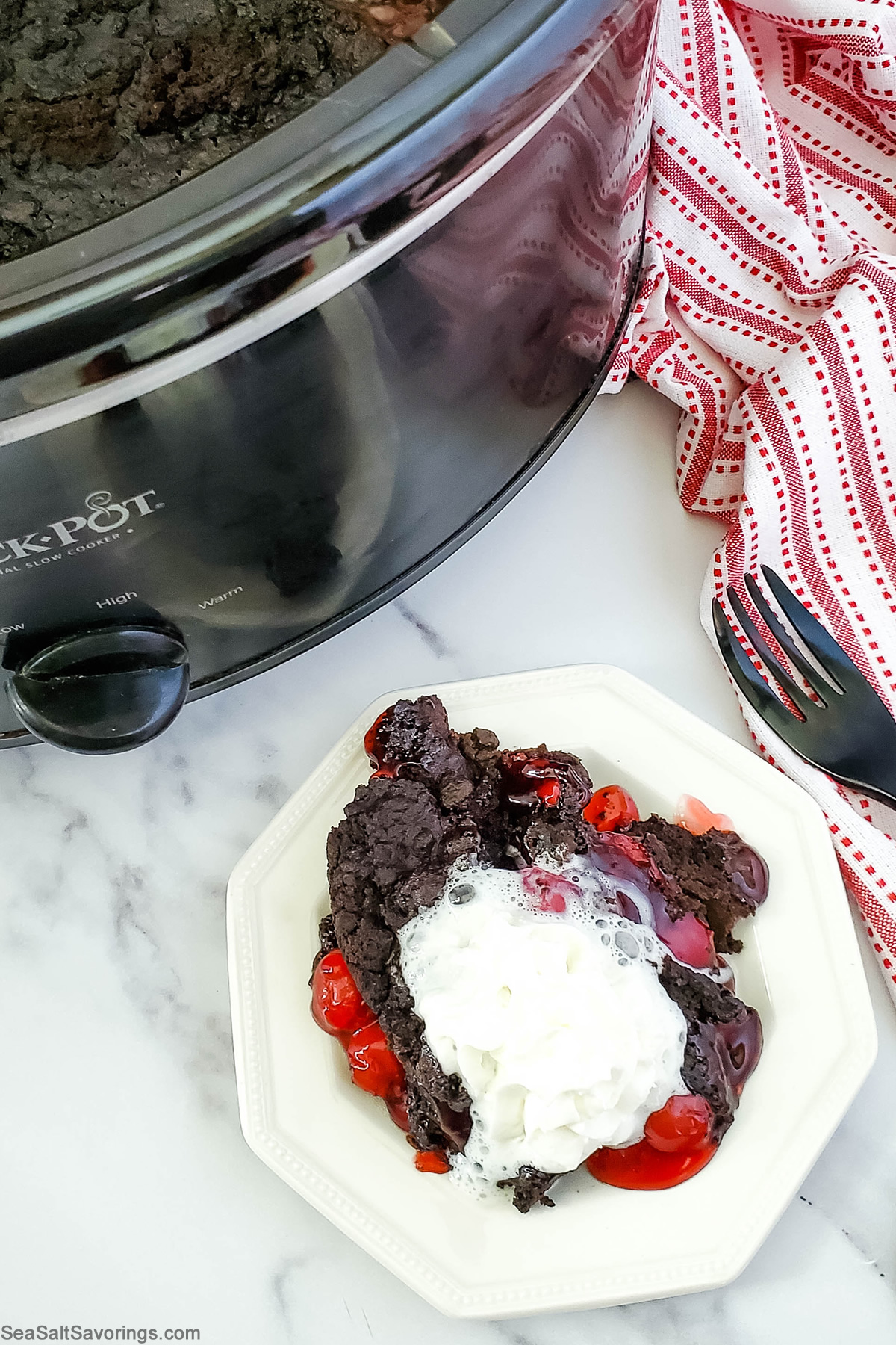 plate with a scoop of chocolate dump cake