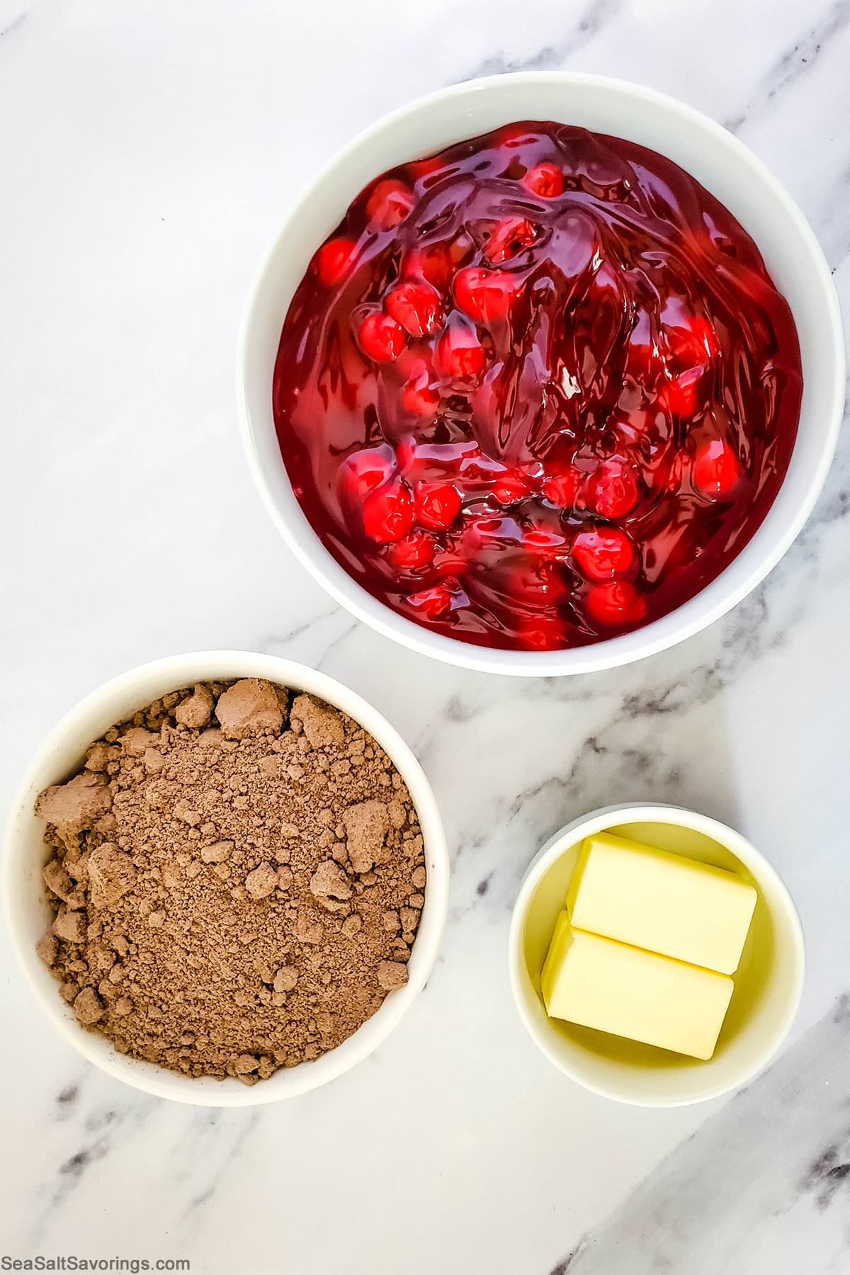 chocolate cherry dump cake ingredients in bowls on a table