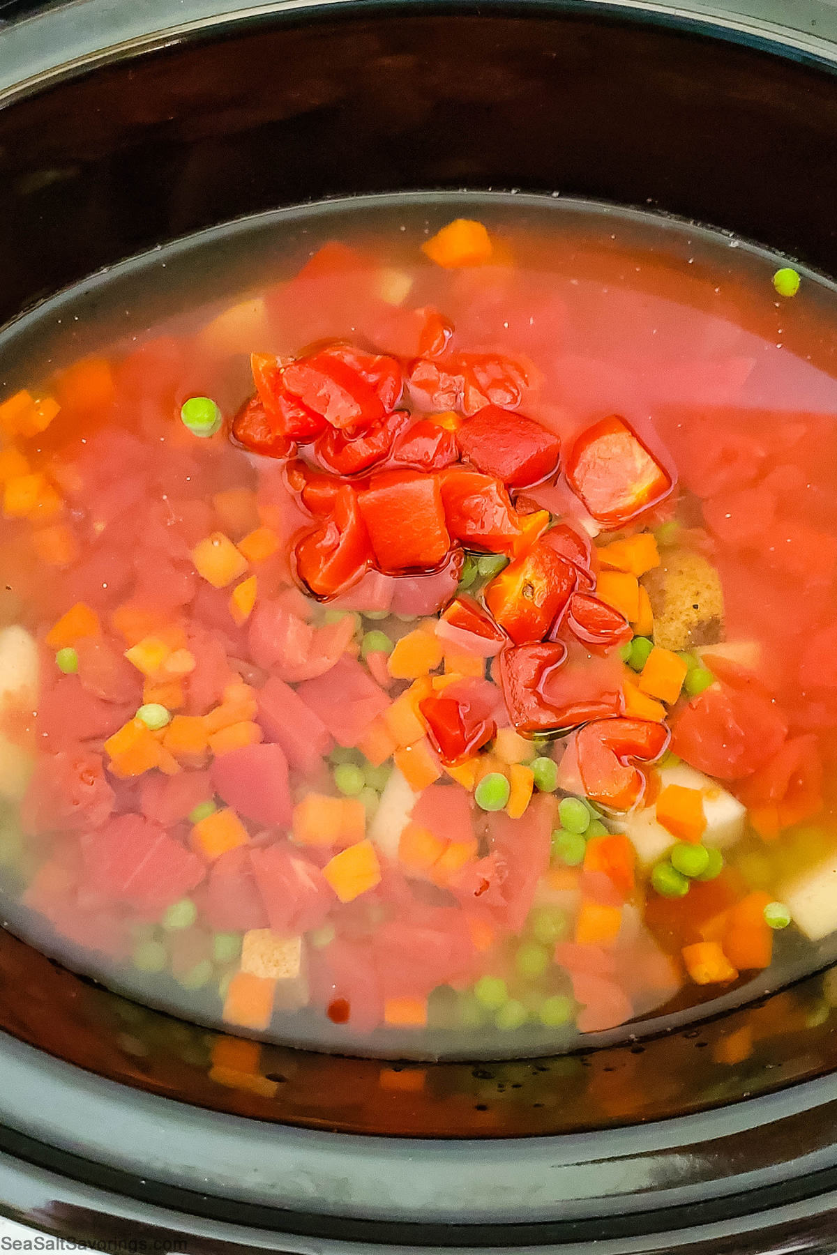 crock pot with all ingredients in and cooking