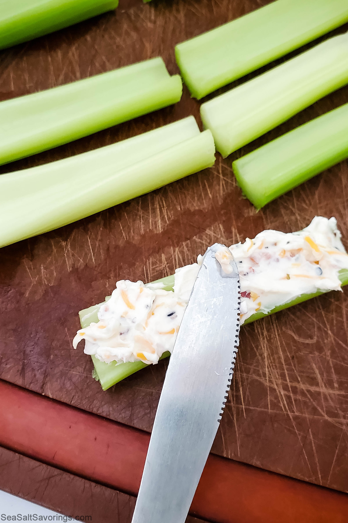 using a fork to fill celery sticks