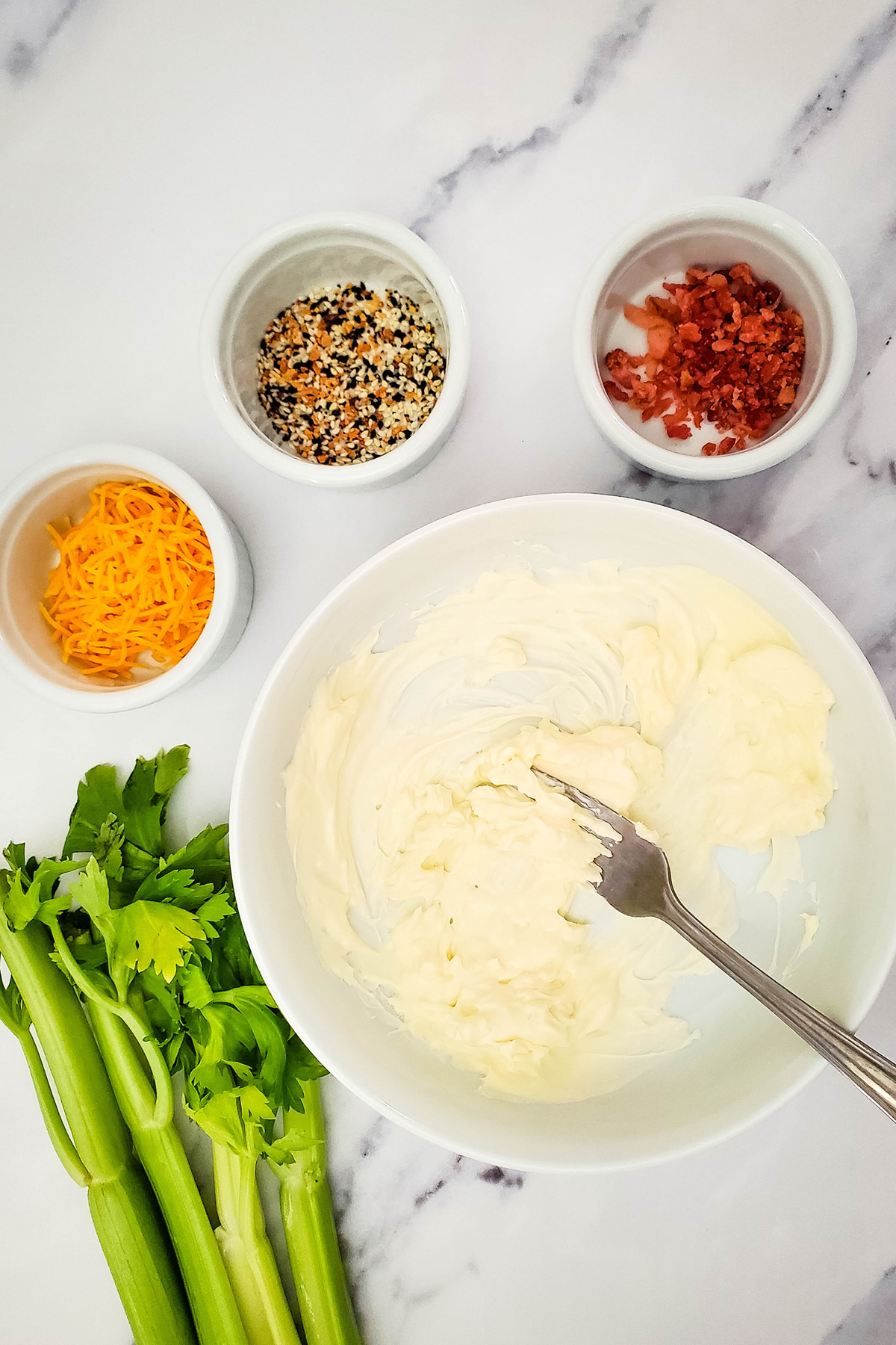 mixing the filling for bacon cheese celery sticks