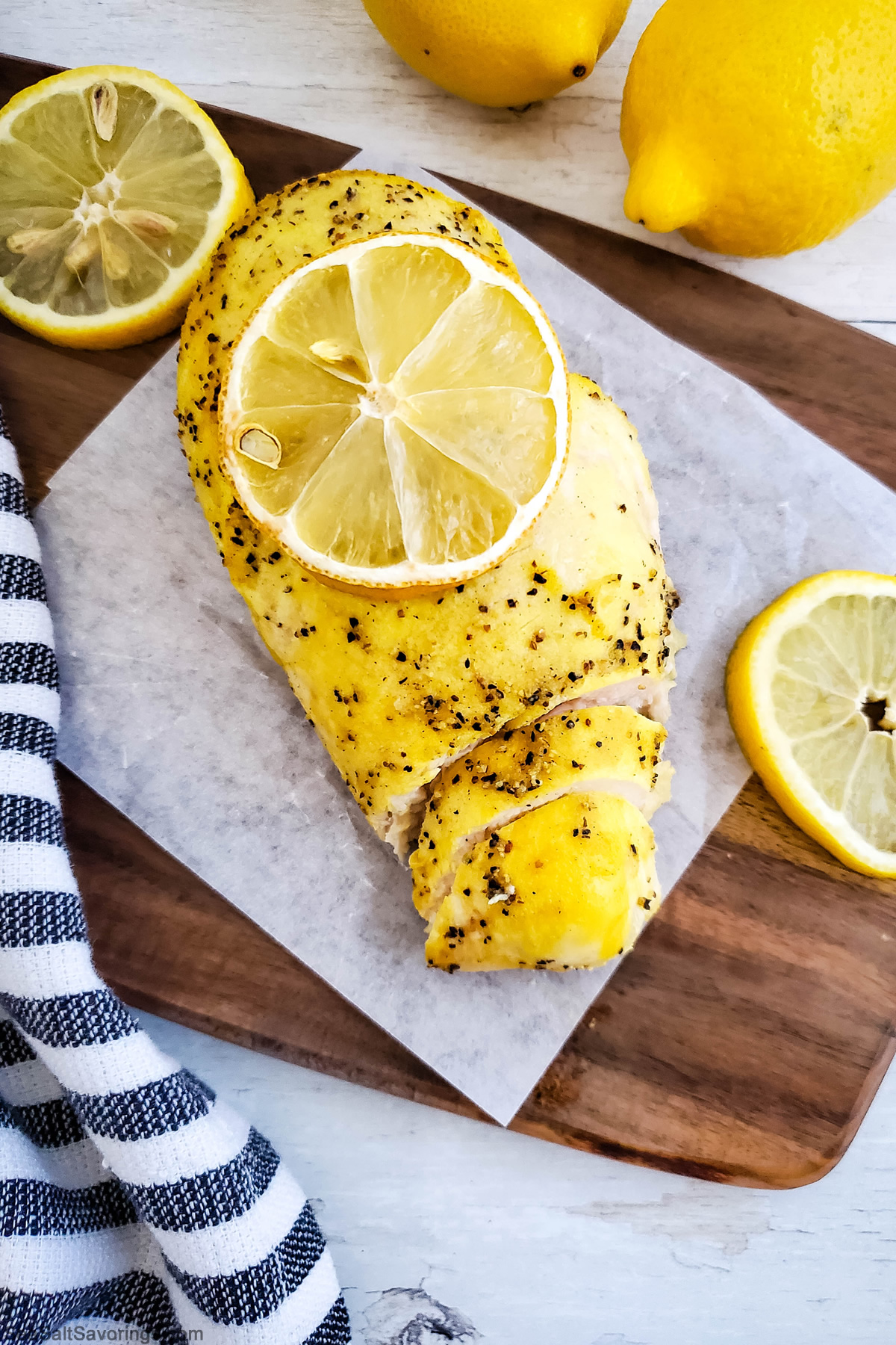 lemon pepper chicken breast with a lemon slice on top