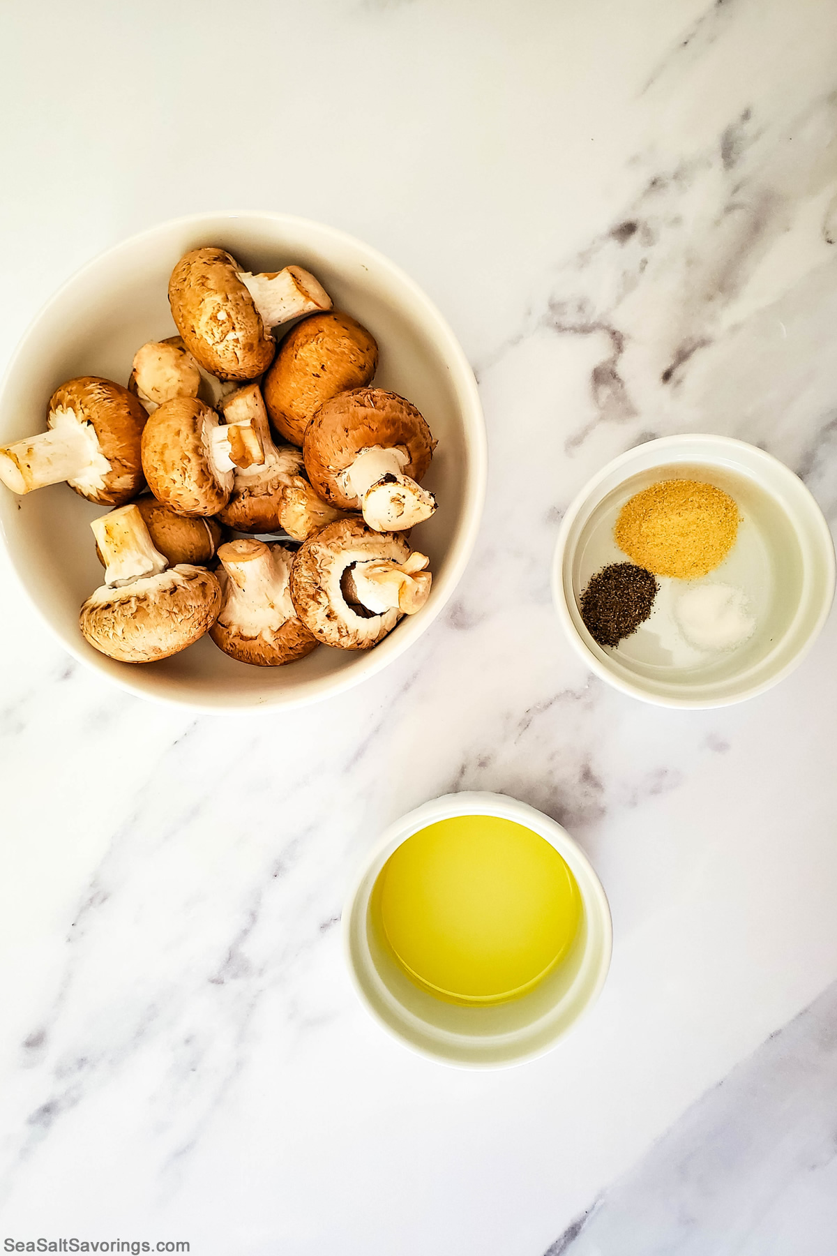 bowls of simple garlic mushroom ingredients such as mushrooms spices and oil