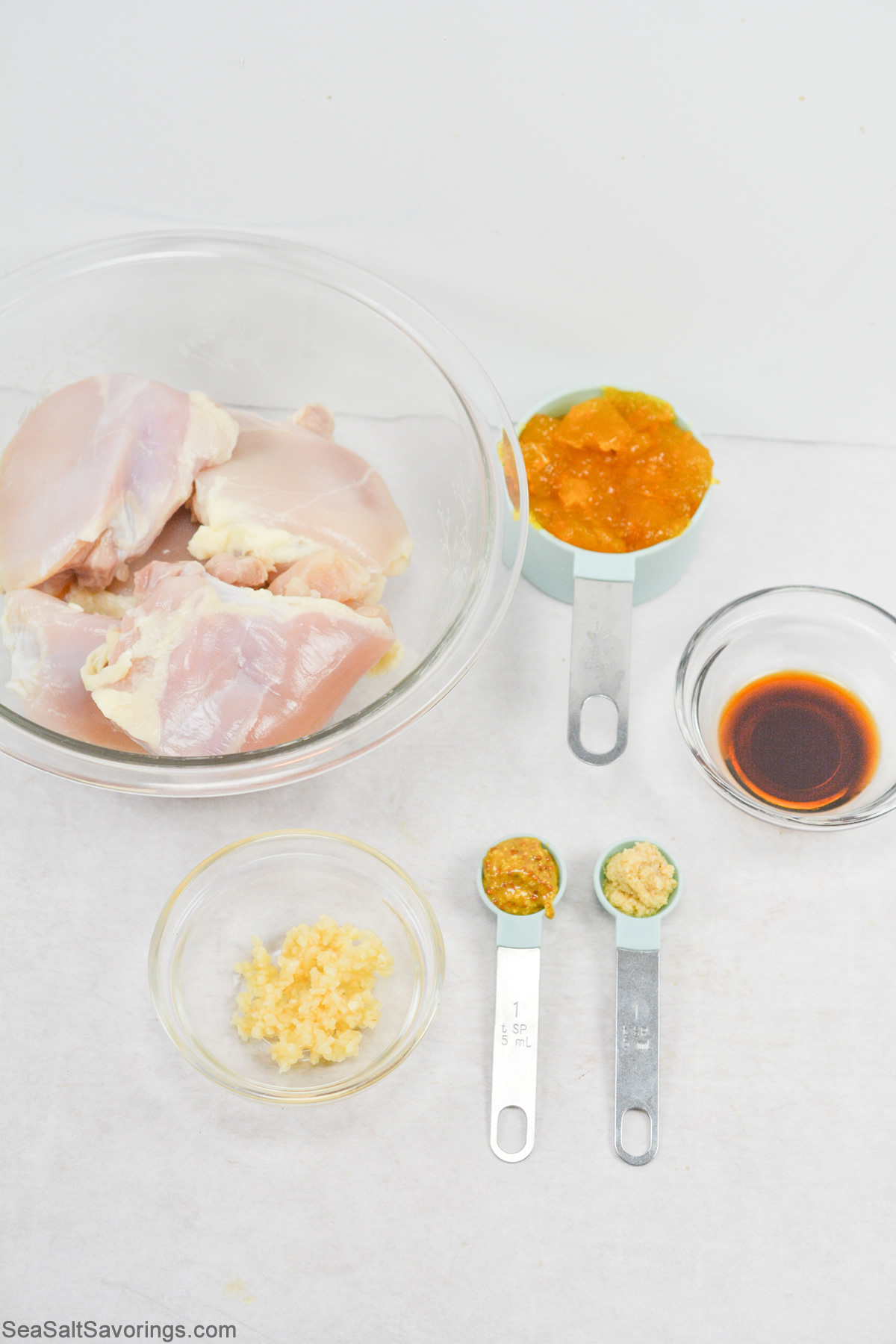 ingredients for apricot glazed chicken thighs on a table