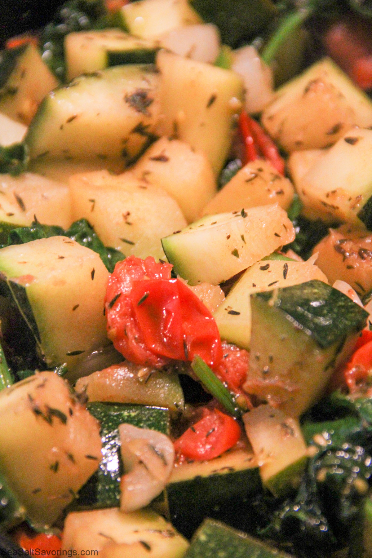 close up view of zucchini skillet cooked and seasoned