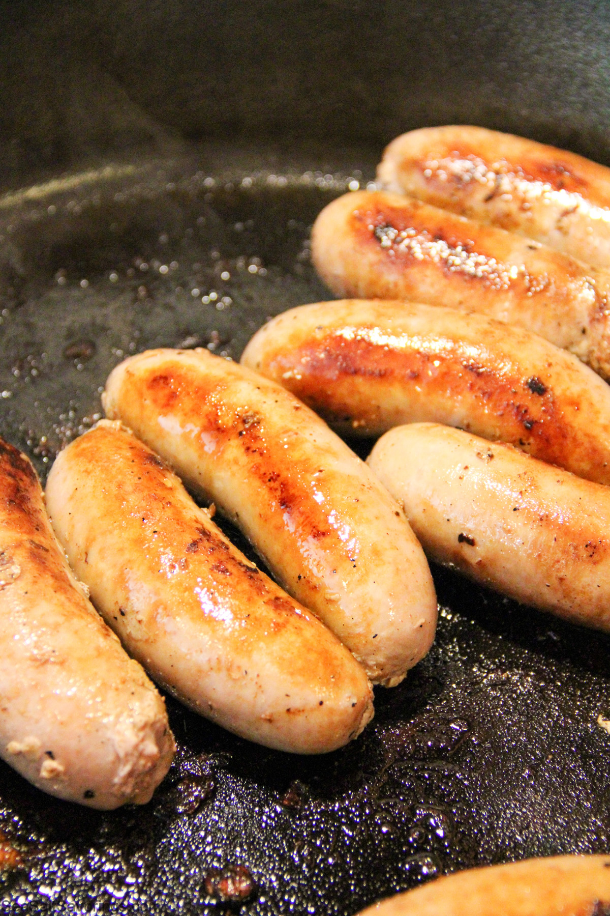 frying sausages in the frying pan