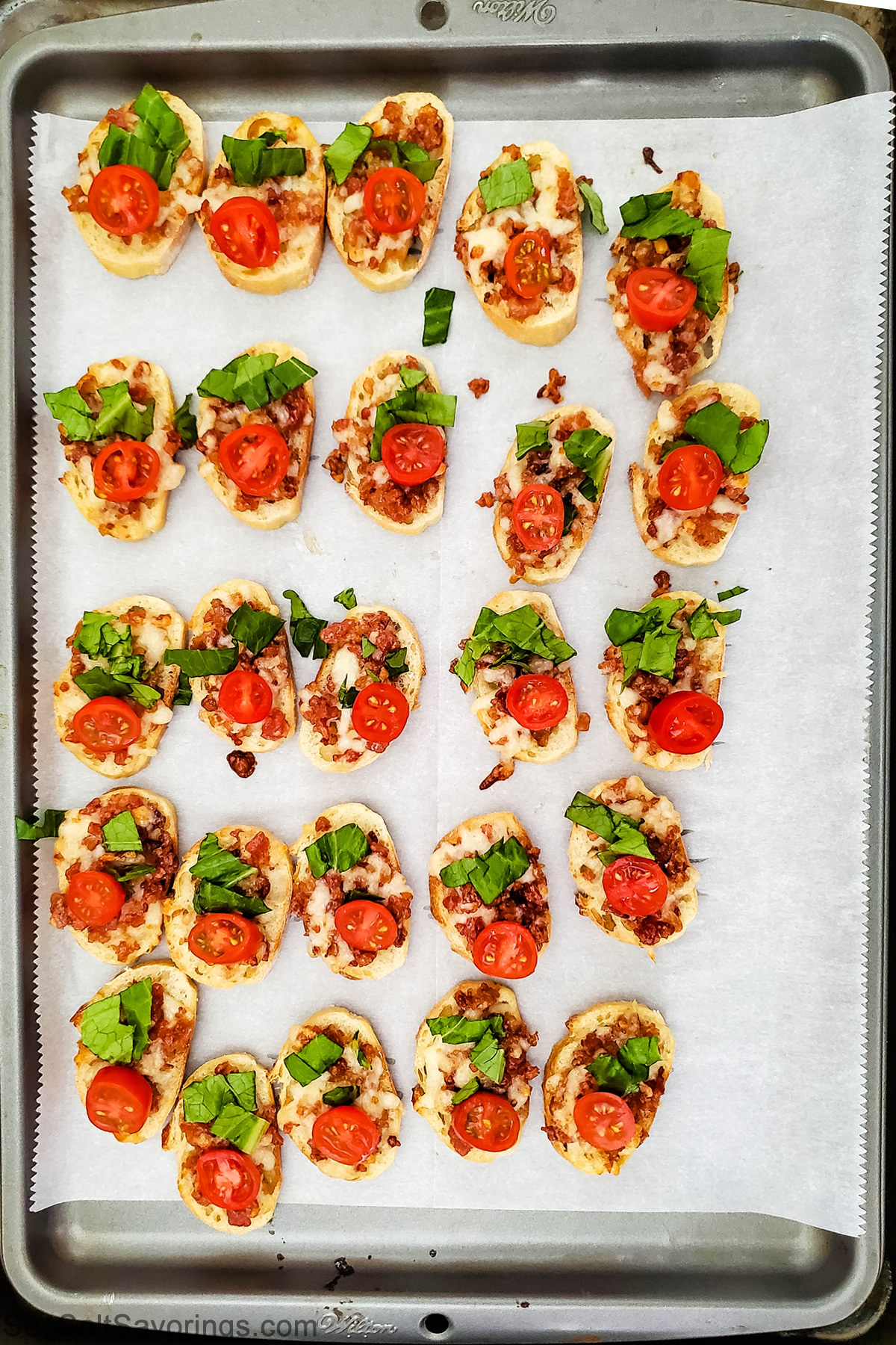 blt crostinis on a baking sheet ready to cook