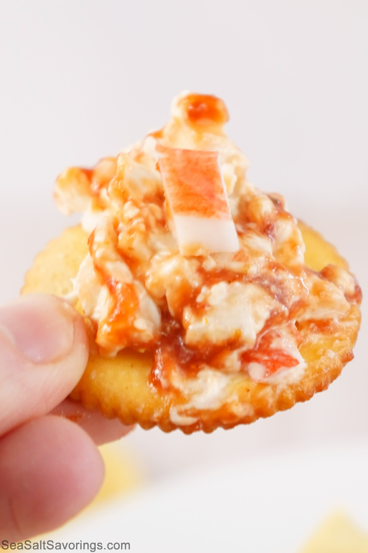 ritz cracker with crab dip on top