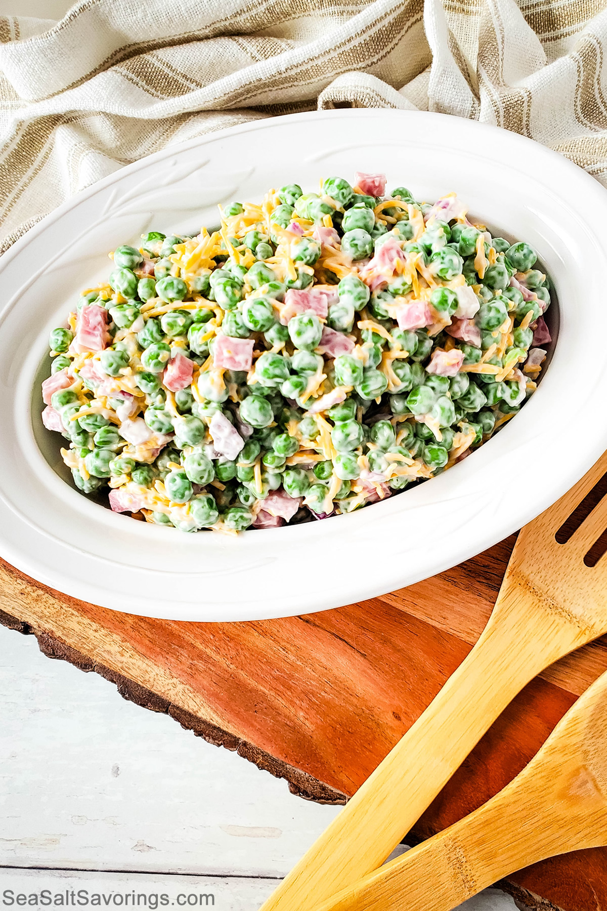 Cold Ham and Pea Salad served in a bowl, featuring diced ham, sweet peas, cheddar cheese, and a creamy dressing