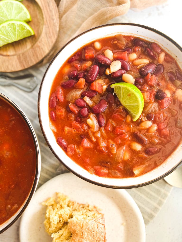 overhead shot of a bowl of chili with a lime wedge on top