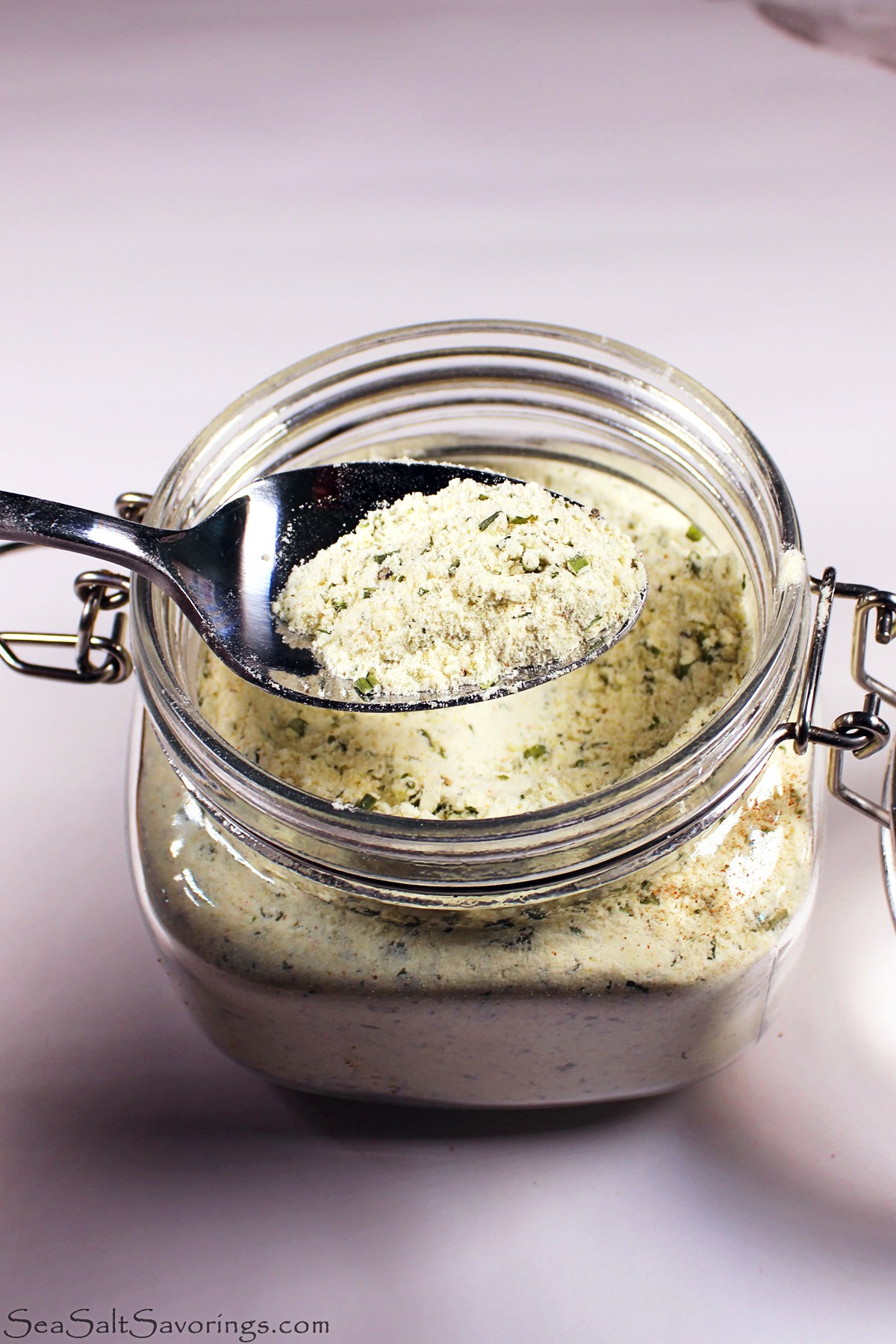 spoonful of ranch seasoning from a glass jar