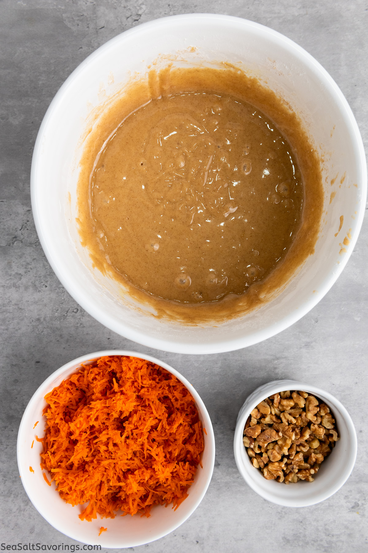 wet ingredients for carrot cupcakes all mixed up in a bowl