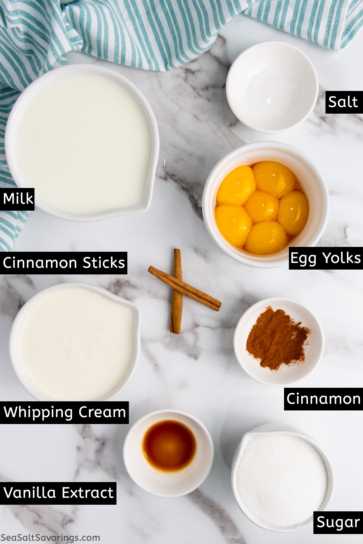 eggnog ingredients in bowls and cups on a table