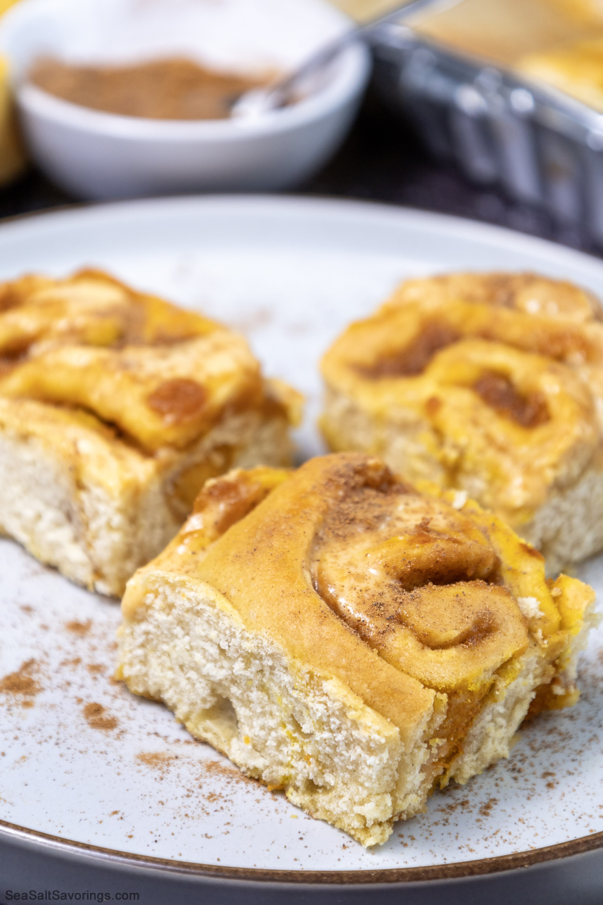 close up view of a plate of pumpkin cinnamon rolls