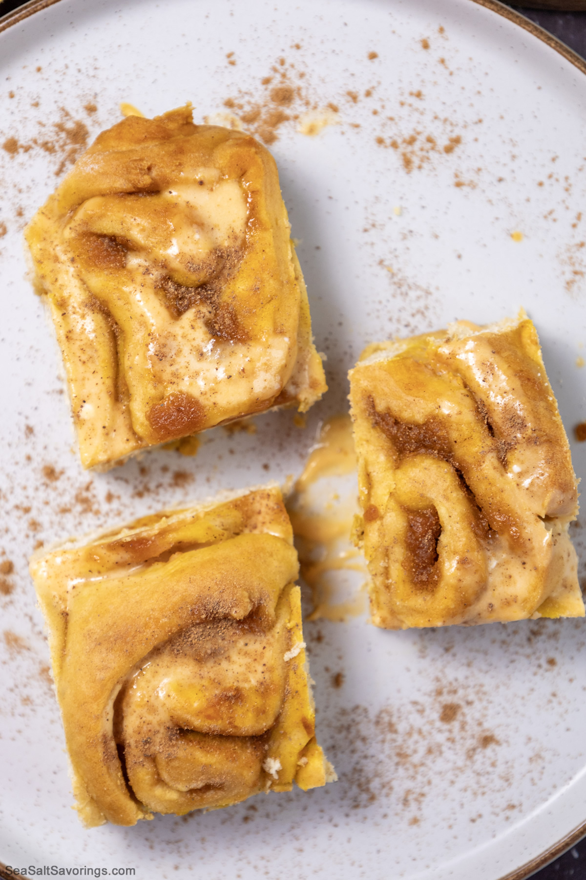 close up view of a plate of pumpkin cinnamon rolls