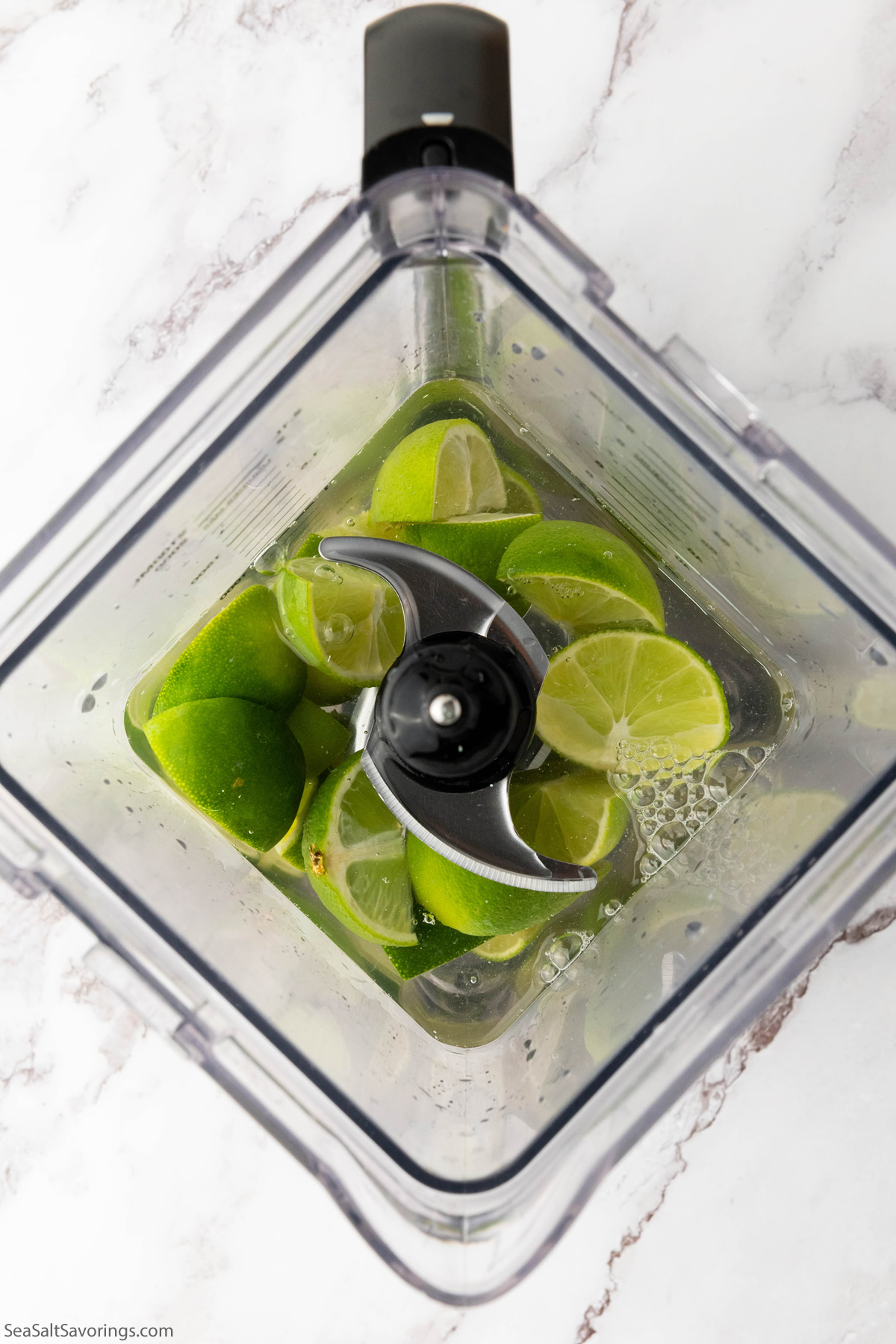 limes and water in blender