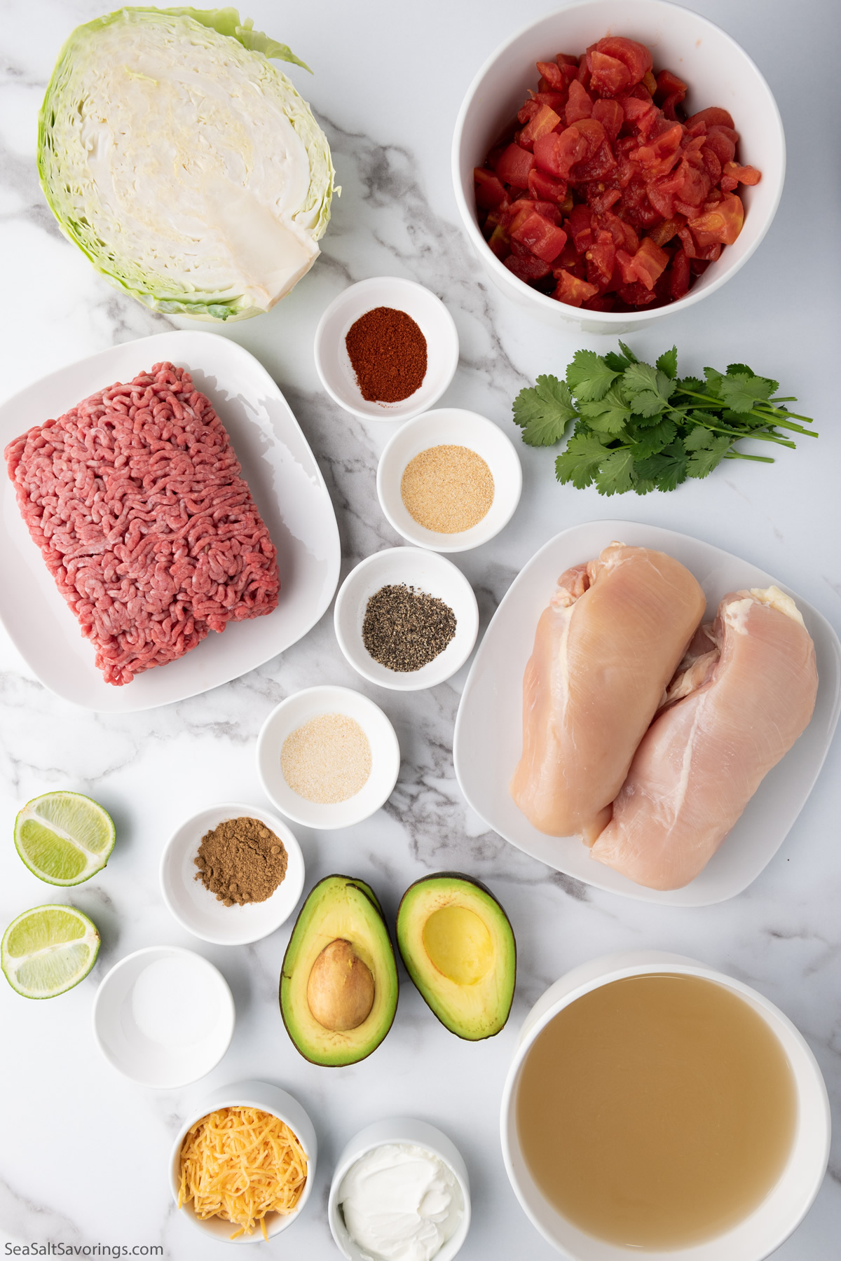 fresh ingredients for taco soup such as chicken breasts and ground beef and avocados