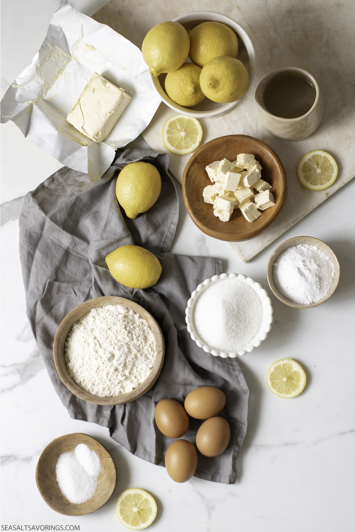 lemons and bowls of butter and sugar and other ingredients