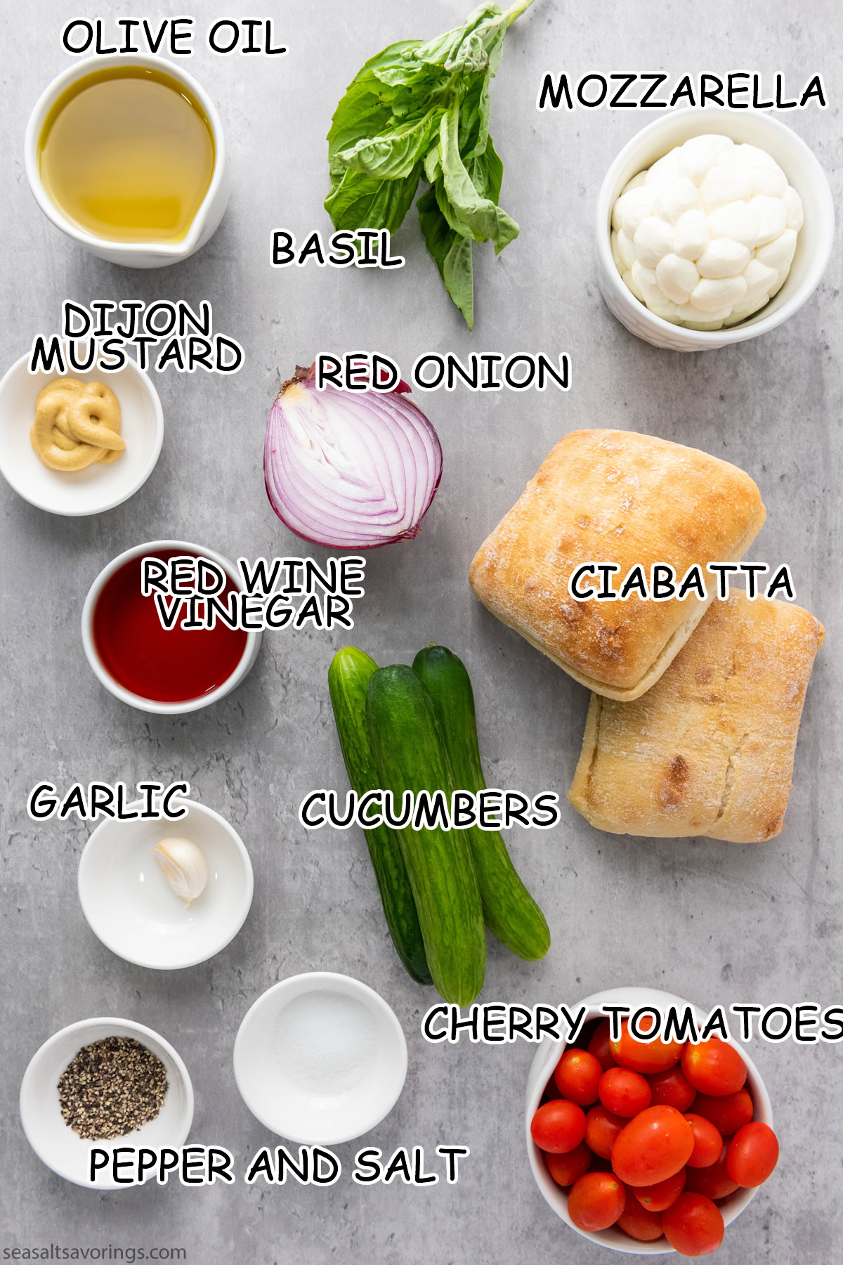 ingredients spread on table to make panzanella salad