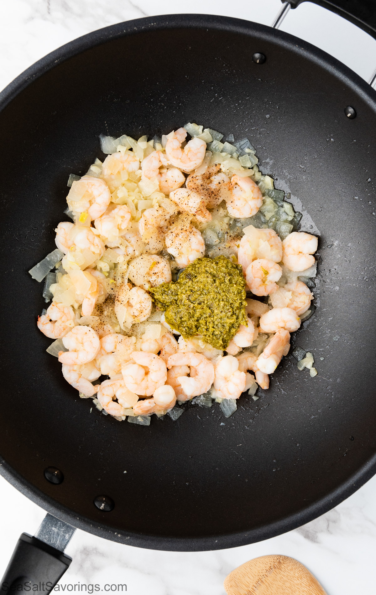 pan with shrimps and spices cooking