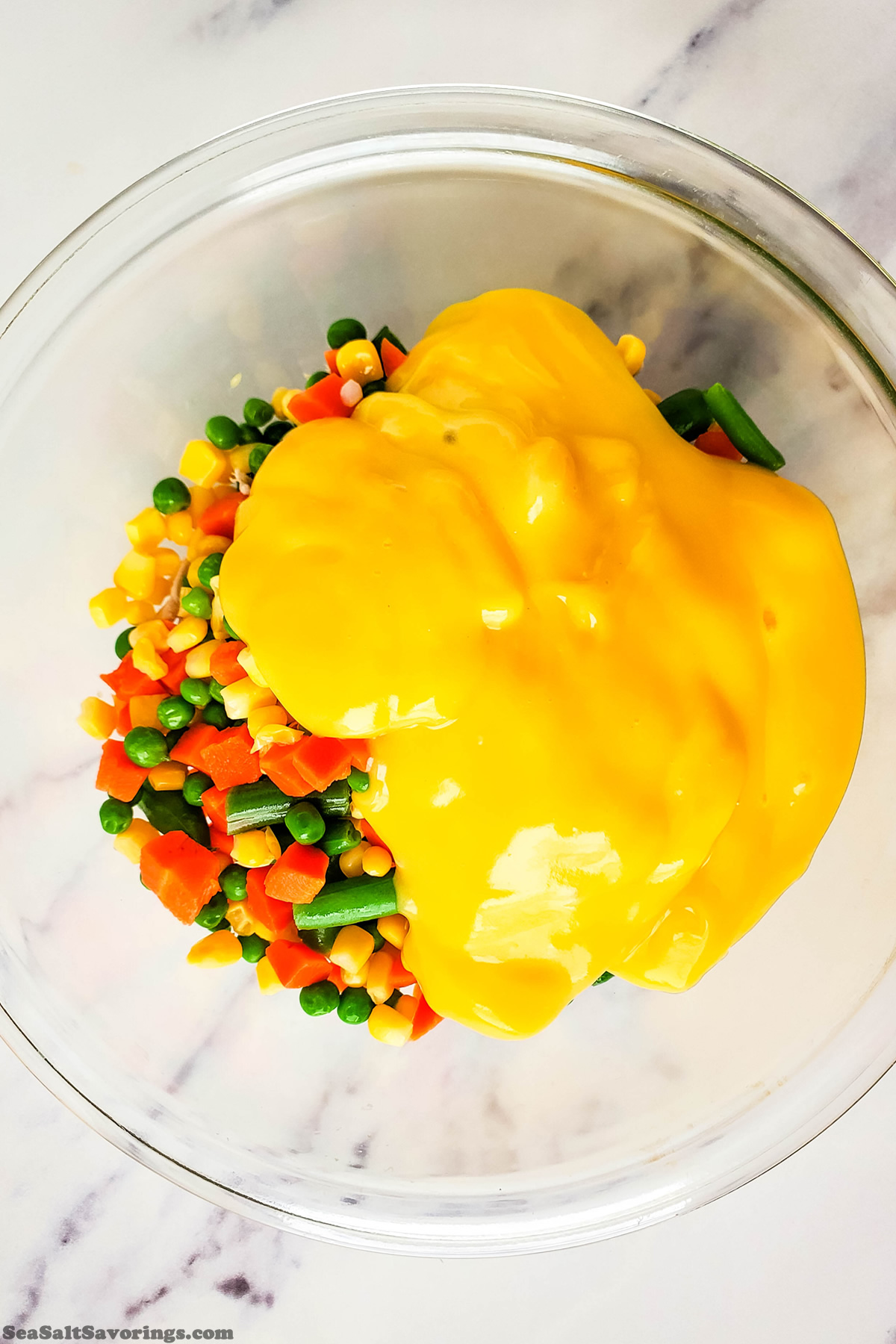 mixing bowl of vegetables and cheese