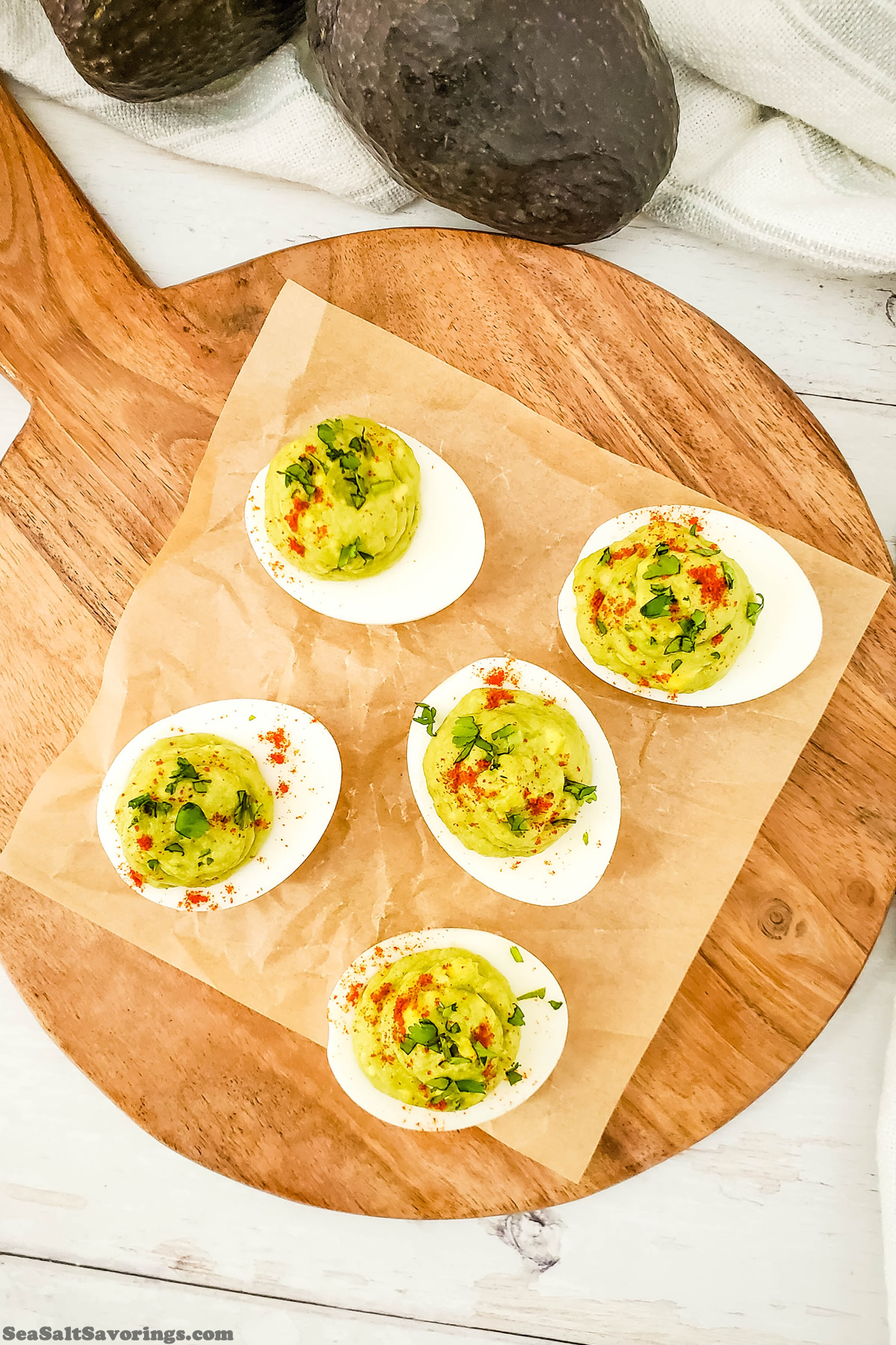 cutting board of avocado deviled eggs